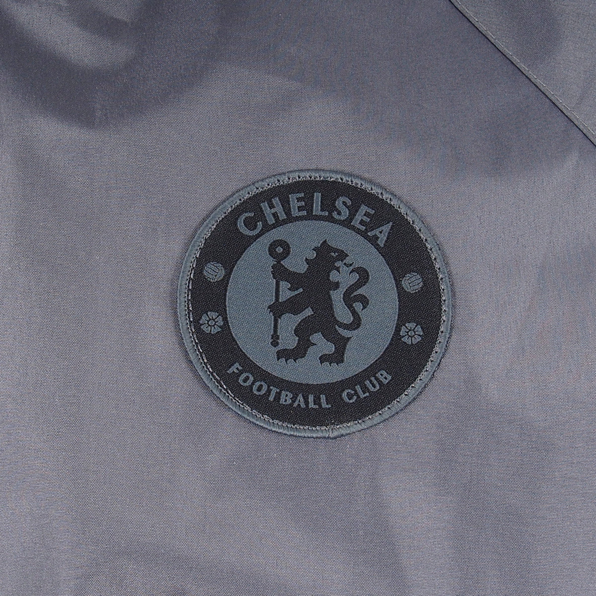 Chelsea adults shower jacket with hood in grey with club crest to chest.