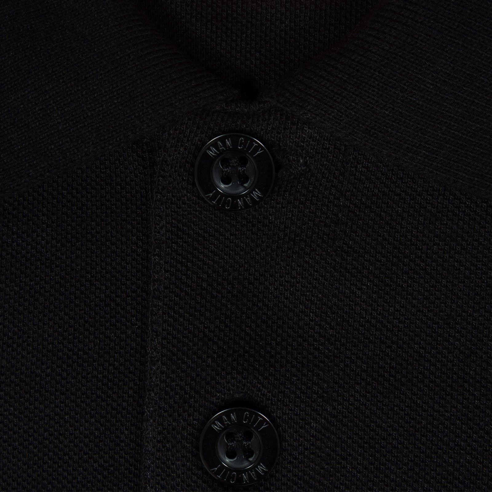 Man City adults polo shirt in black with club crest to the chest.