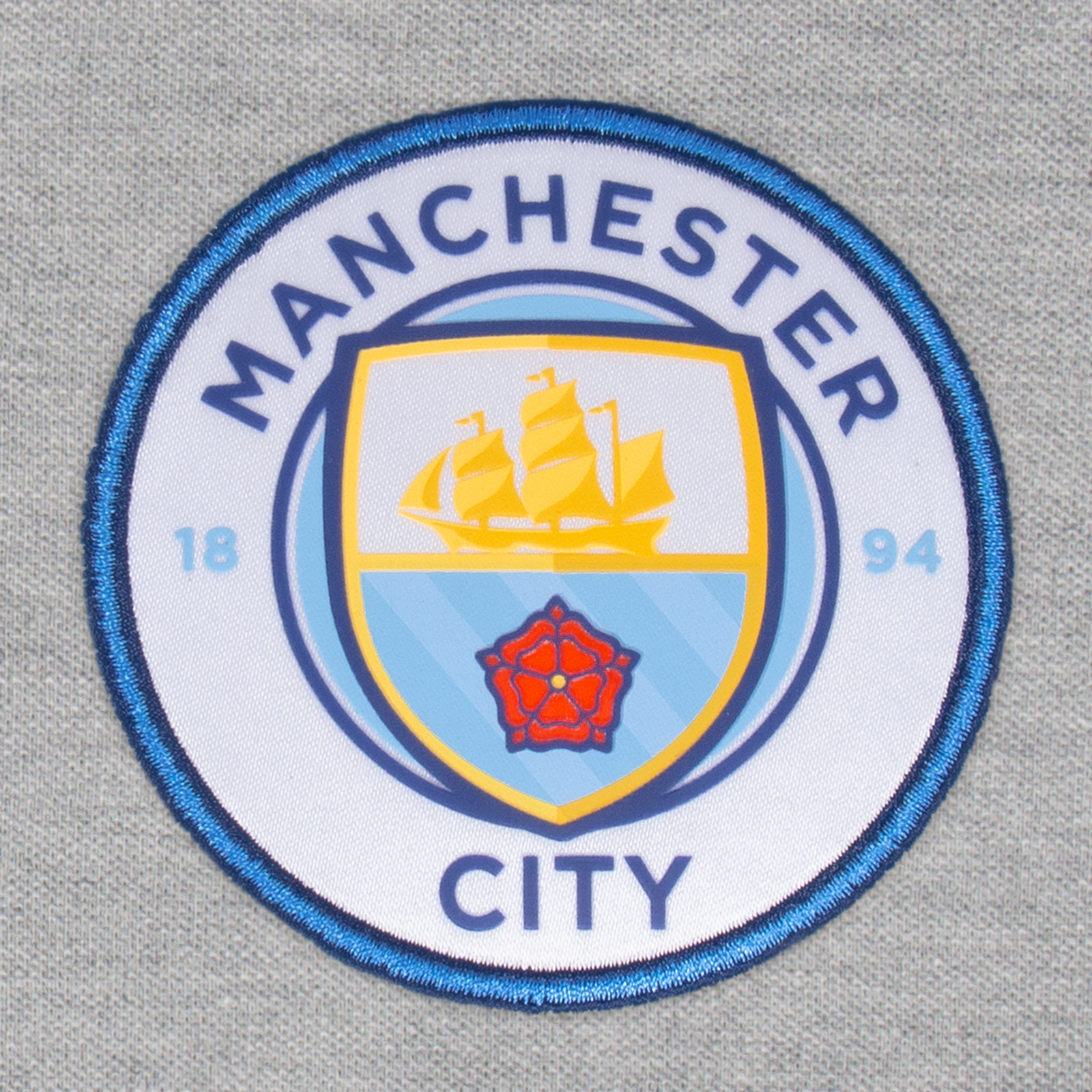 Man City adults polo shirt in grey with club crest to the chest.