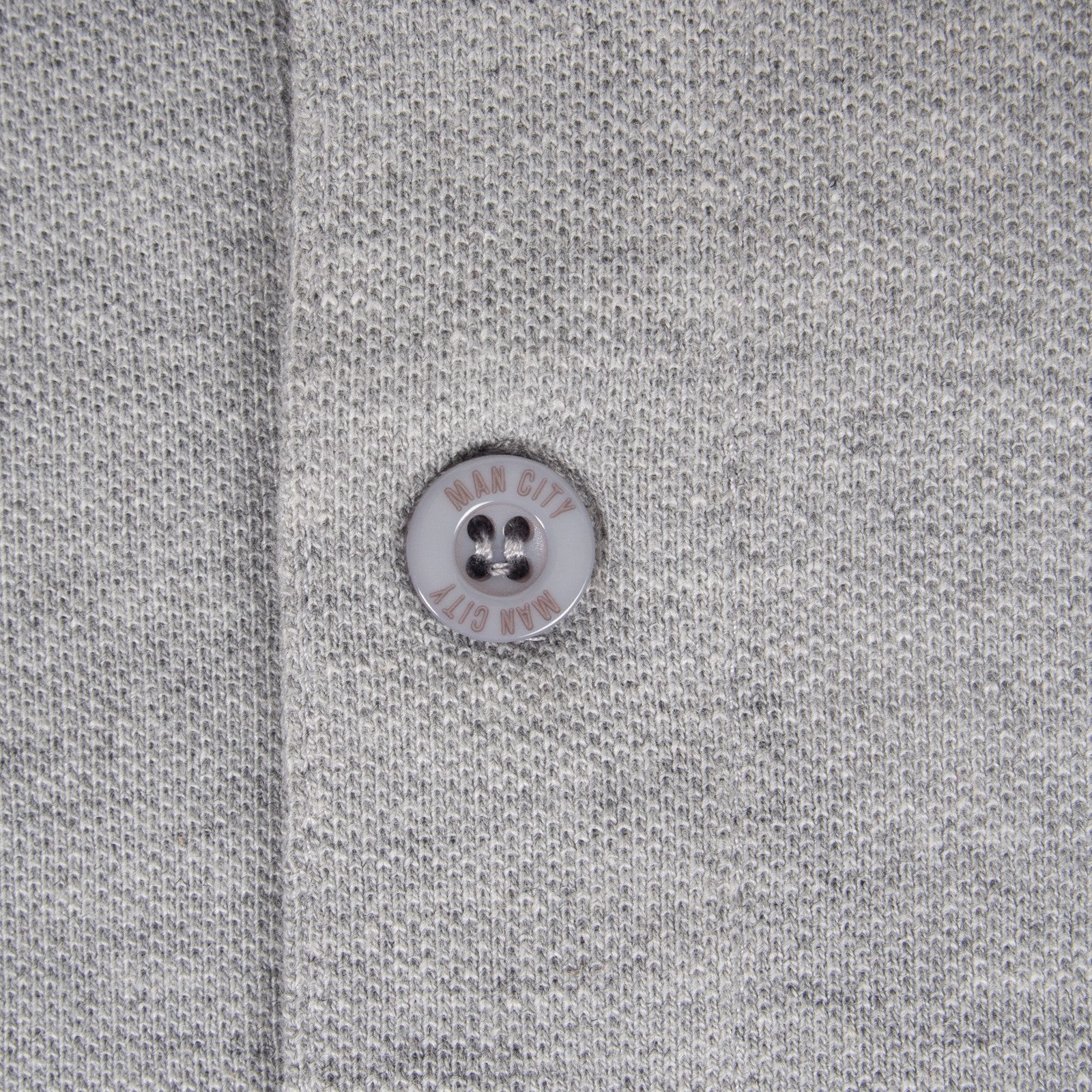 Man City adults polo shirt in grey with club crest to the chest.