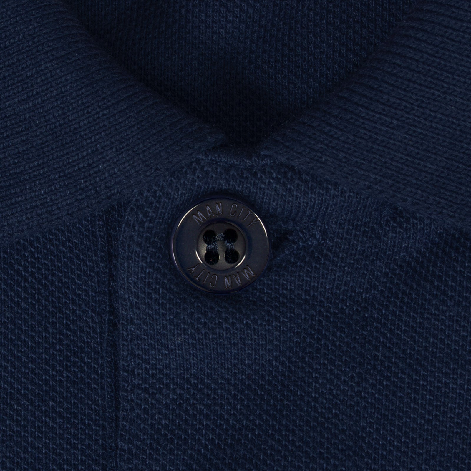 Man City adults polo shirt in navy blue with club crest to the chest.