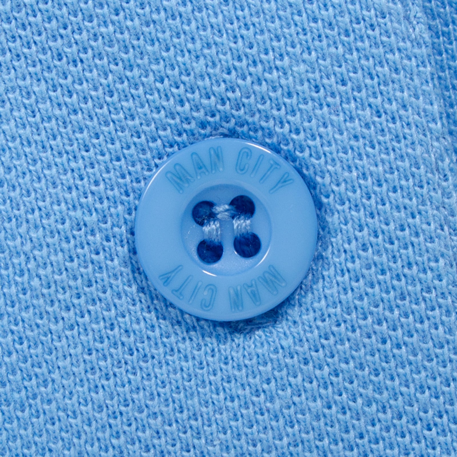Man City adults polo shirt in sky blue with club crest to the chest.