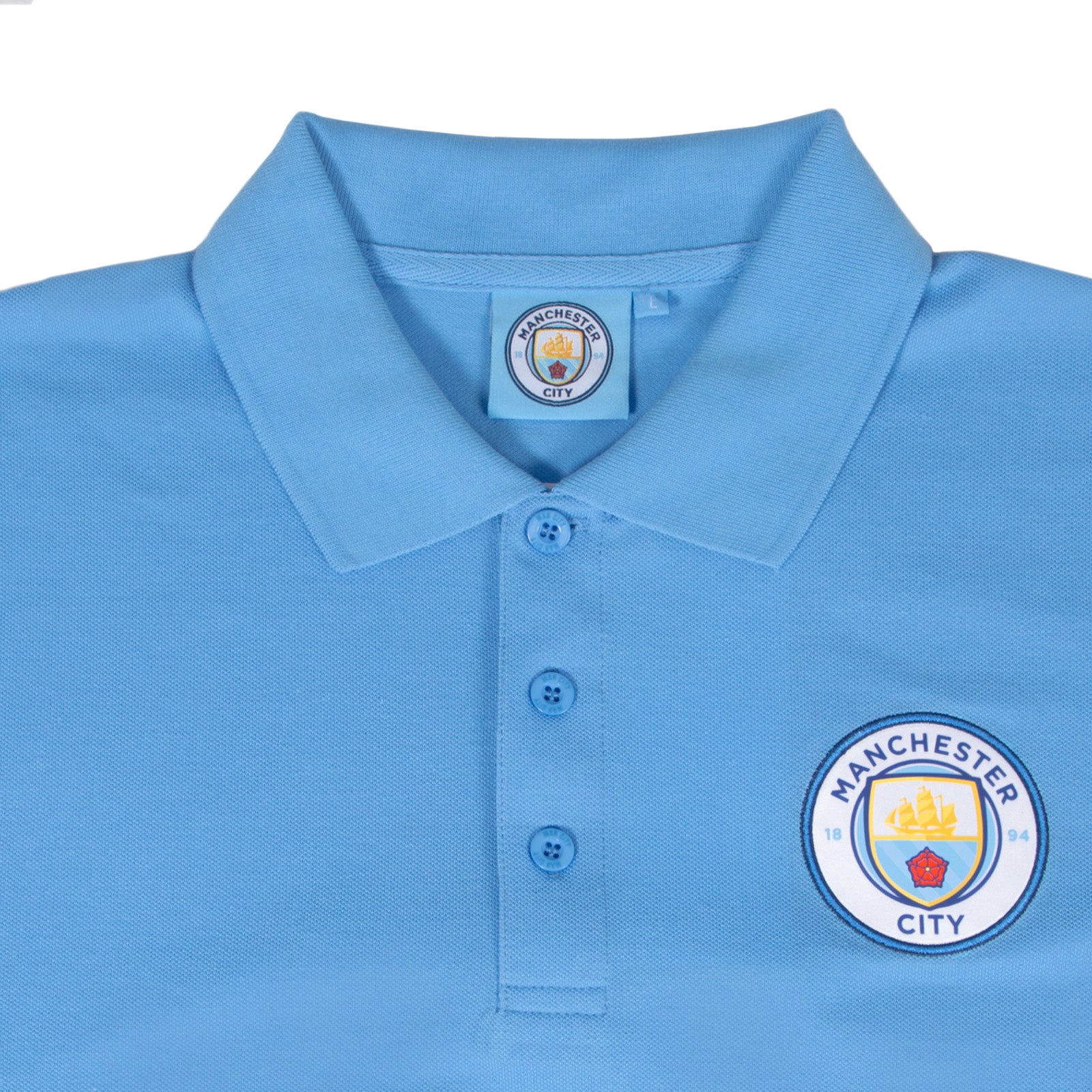 Man City adults polo shirt in sky blue with club crest to the chest.