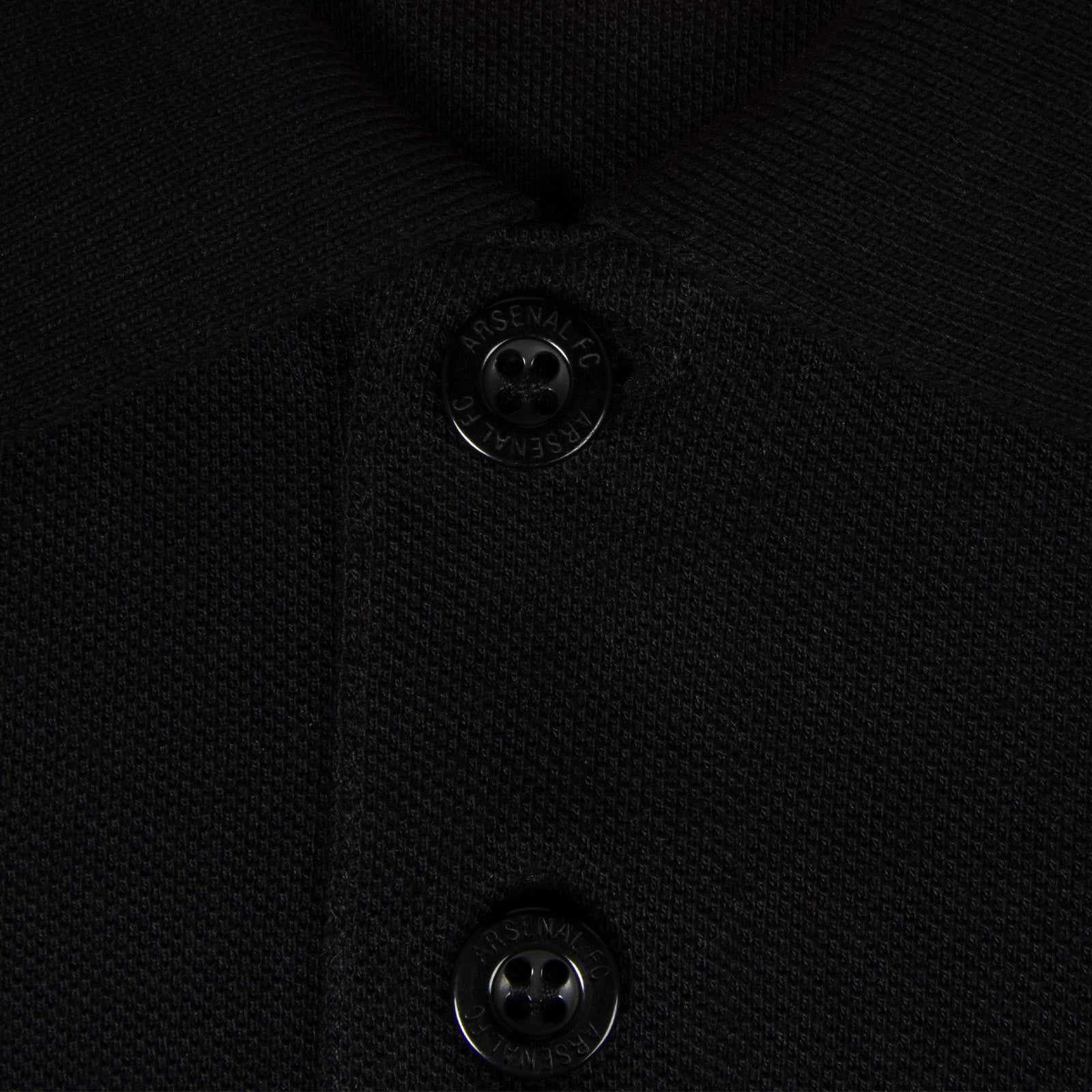 Arsenal polo shirt for adults in black with contrast sleeve, club crest and canon to chest.