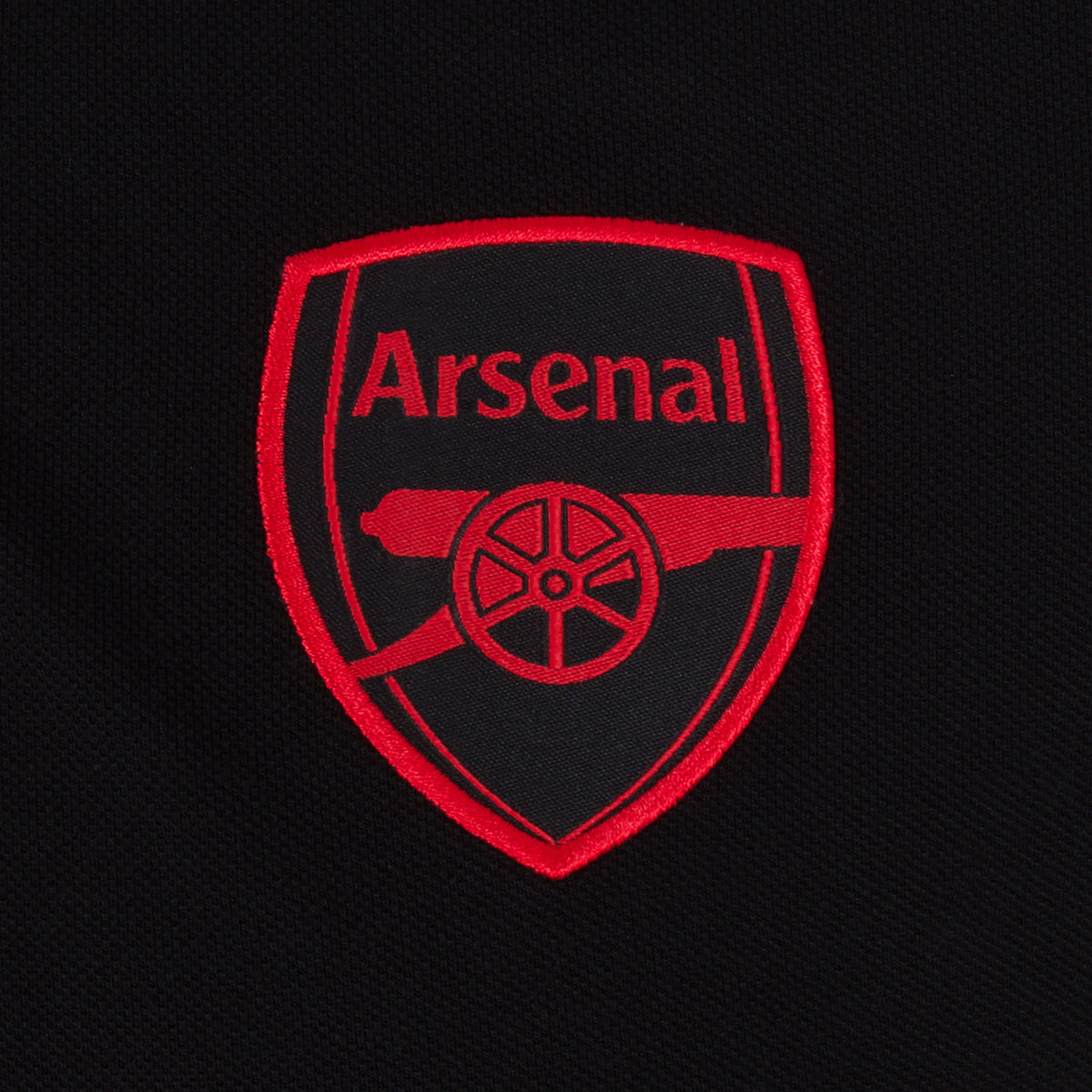 Arsenal polo shirt for adults in black featuring the club crest and Champions 2026 graphic to the chest