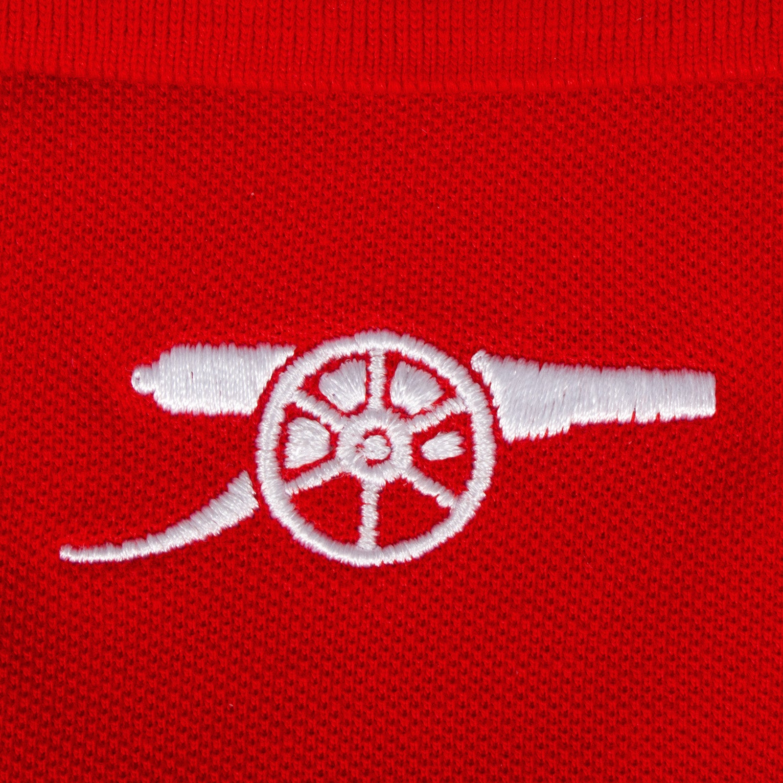 Arsenal polo shirt for kids in red with club crest and canon to chest.
