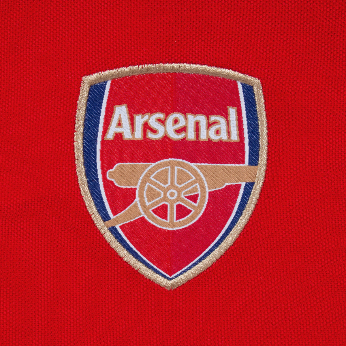 Arsenal polo shirt for adults in red featuring the club crest and Champions 2026 graphic to the chest