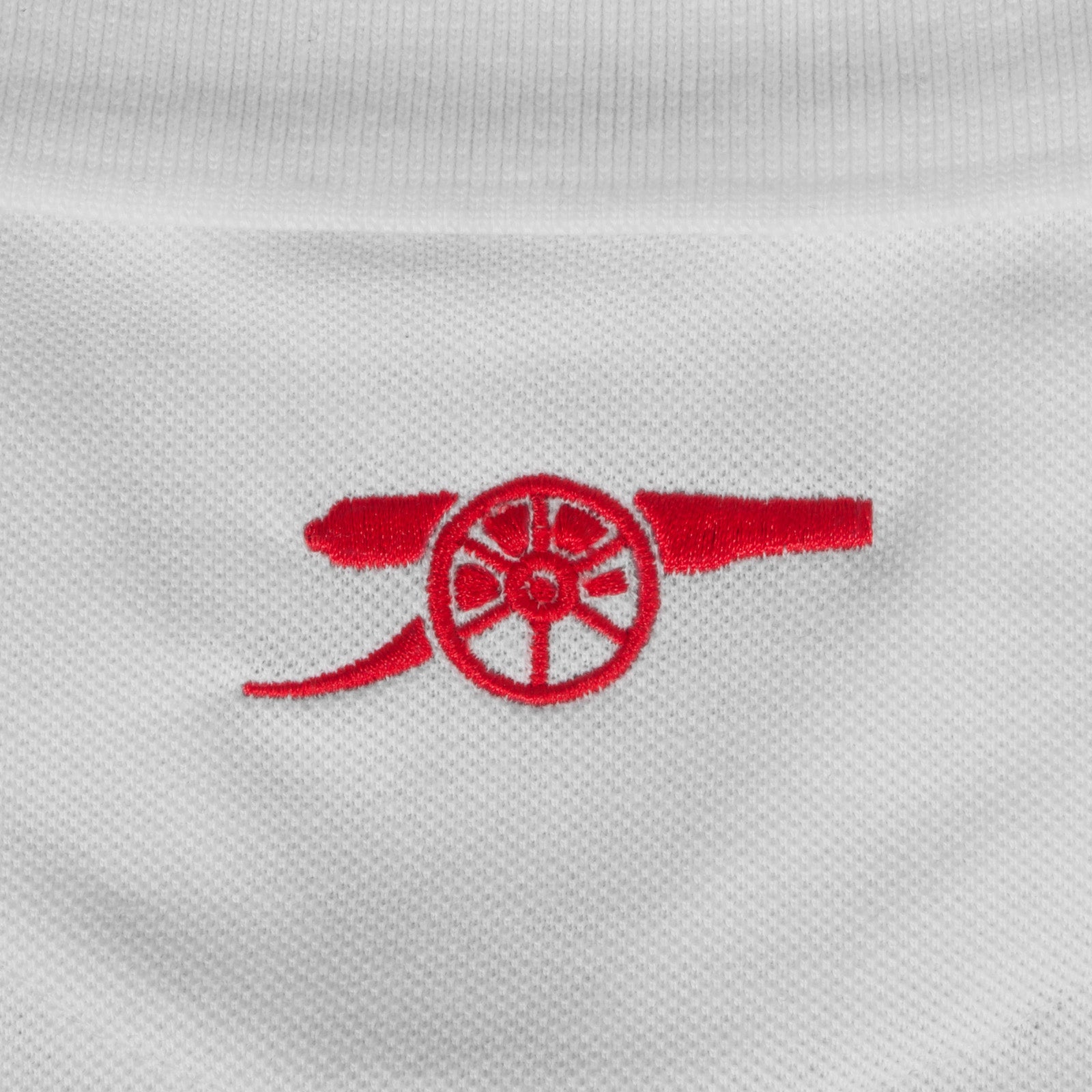 Arsenal polo shirt for adults in white featuring the club crest and Champions 2026 graphic to the chest