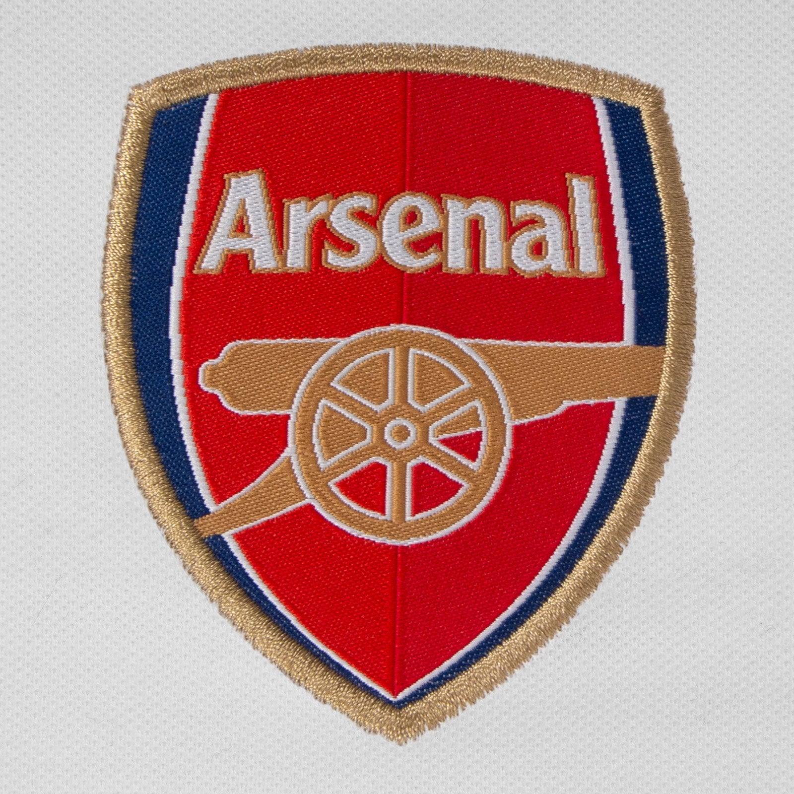 Arsenal polo shirt for adults in white featuring the club crest and budapest 2026 graphic to the chest