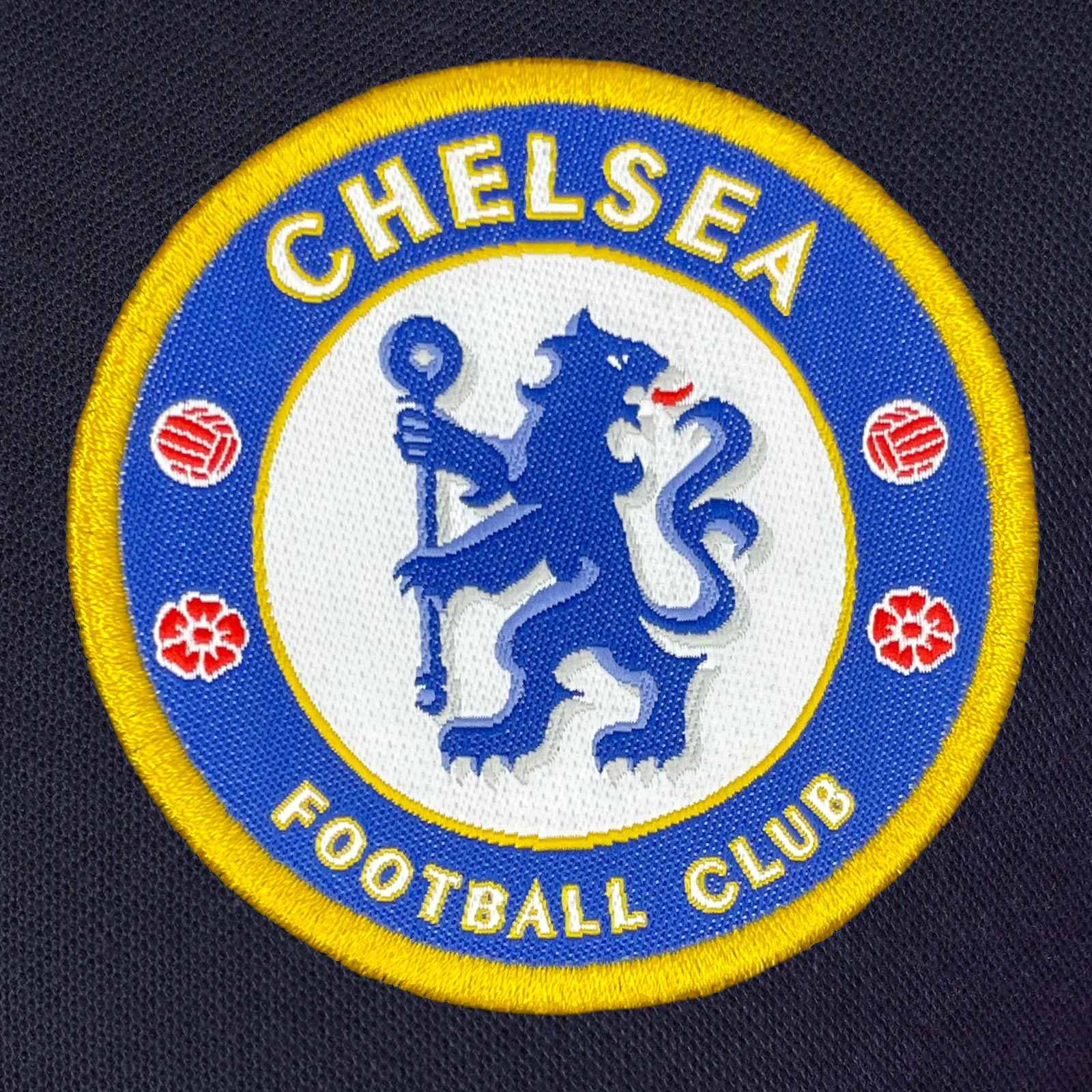 Chelsea adults polo shirt in navy with crest and Chelsea FC text to chest
