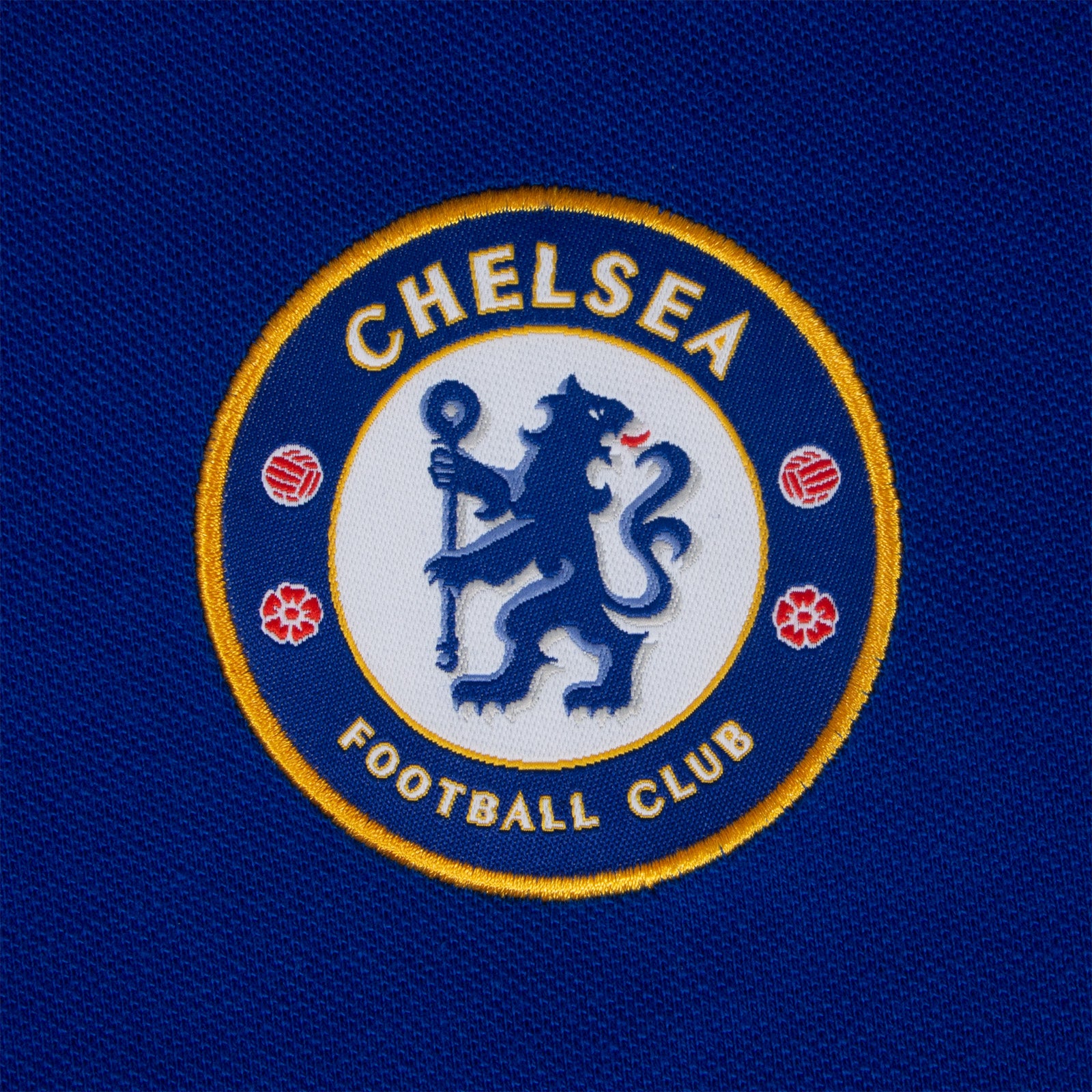 Chelsea adults polo shirt in royal blue with crest and Chelsea FC text to chest