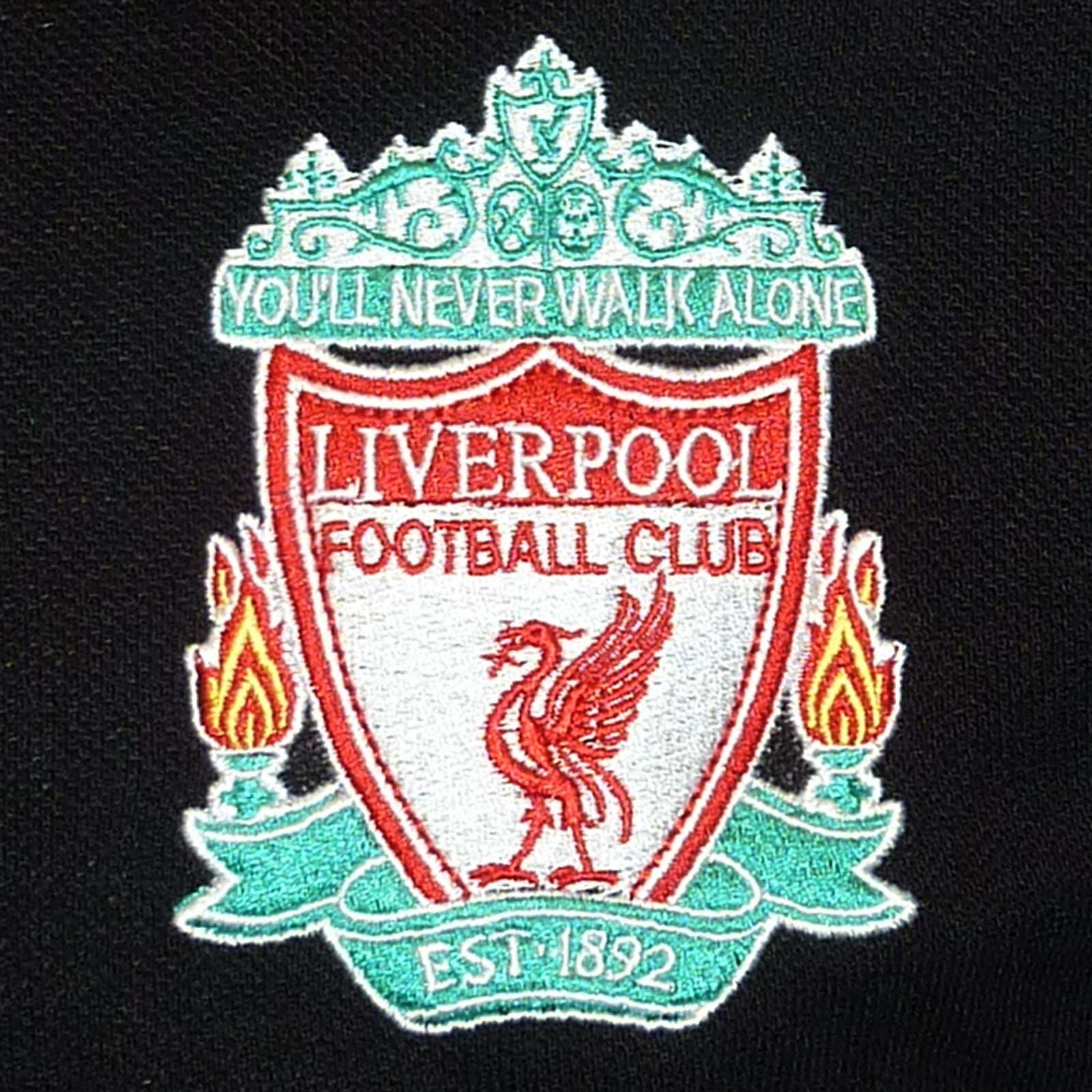 Liverpool adults polo shirt in black & contrast sleeve with LFC badge and Liverpool FC text to chest.