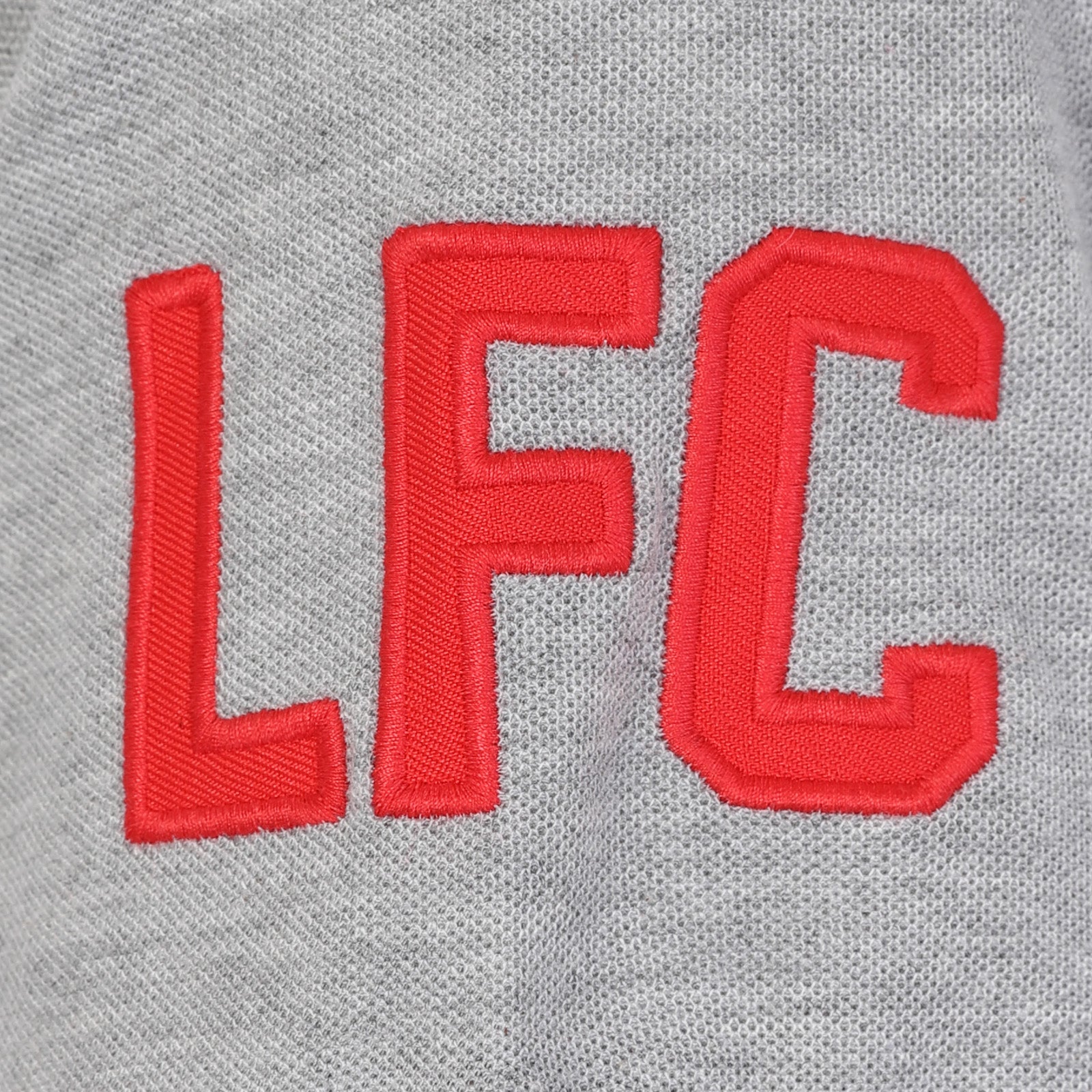 Liverpool adults polo shirt in black & contrast sleeve with LFC badge and Liverpool FC text to chest.