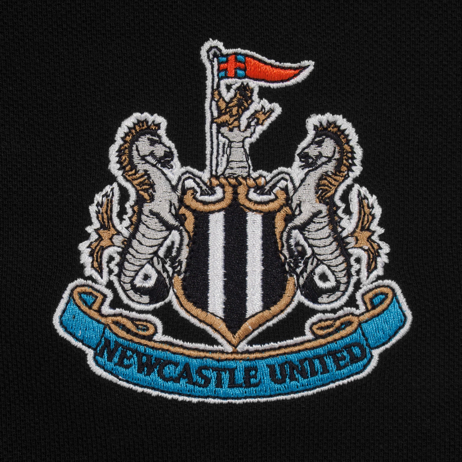 Newcastle Utd adults polo shirt in black with contrast sleeve and a NUFC badge and text to chest.