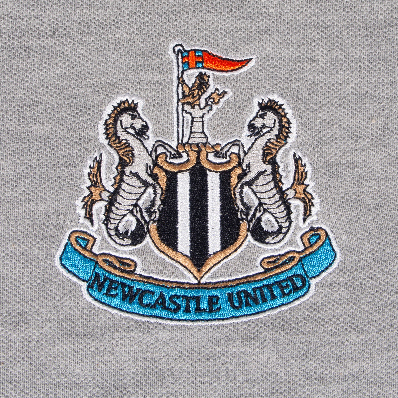 Newcastle Utd adults polo shirt in grey with NUFC badge and text to chest.
