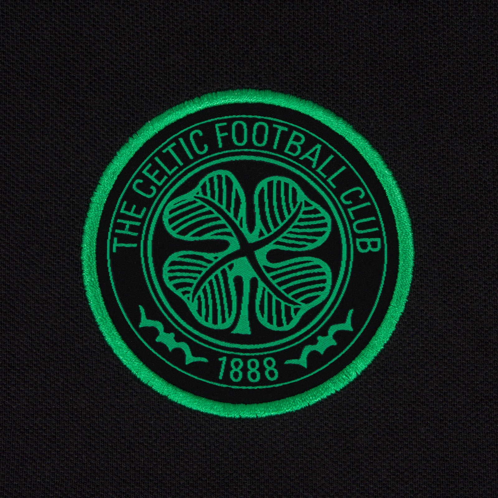 Celtic adults polo shirt in black with contrast sleeve and club crest to chest