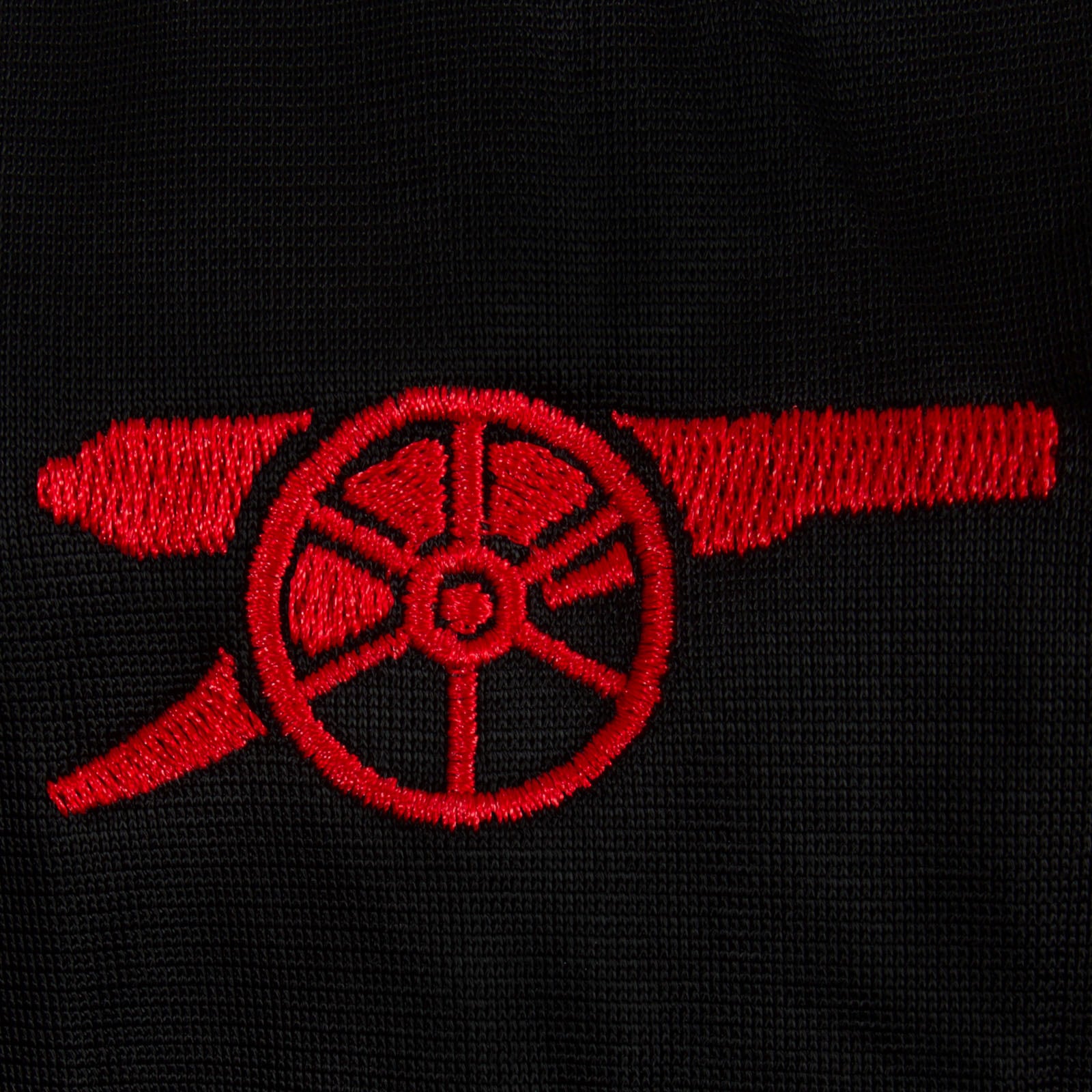 Arsenal adults retro track jacket in black with club crest to chest.