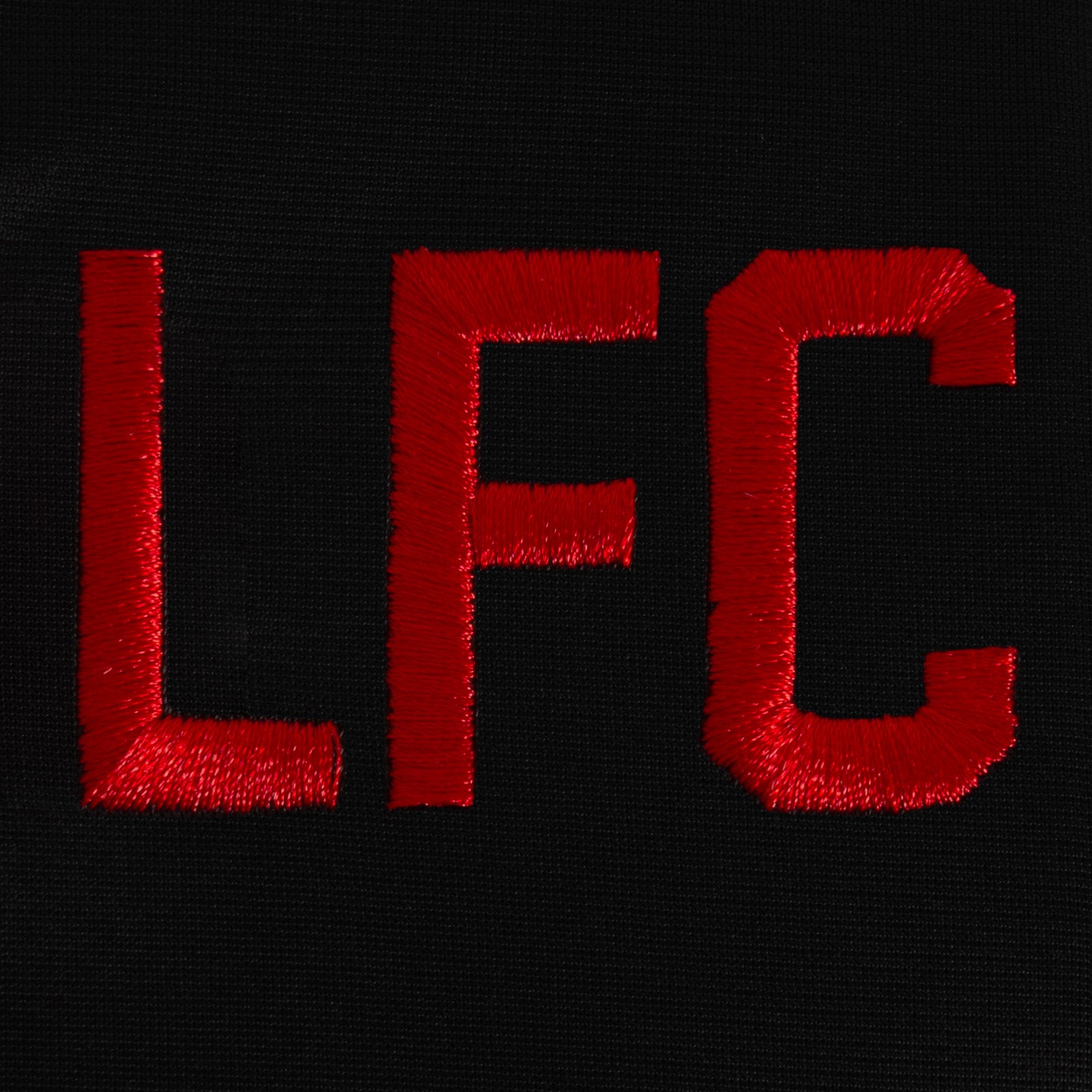 Liverpool adults retro track jacket in black with woven club crest to chest.