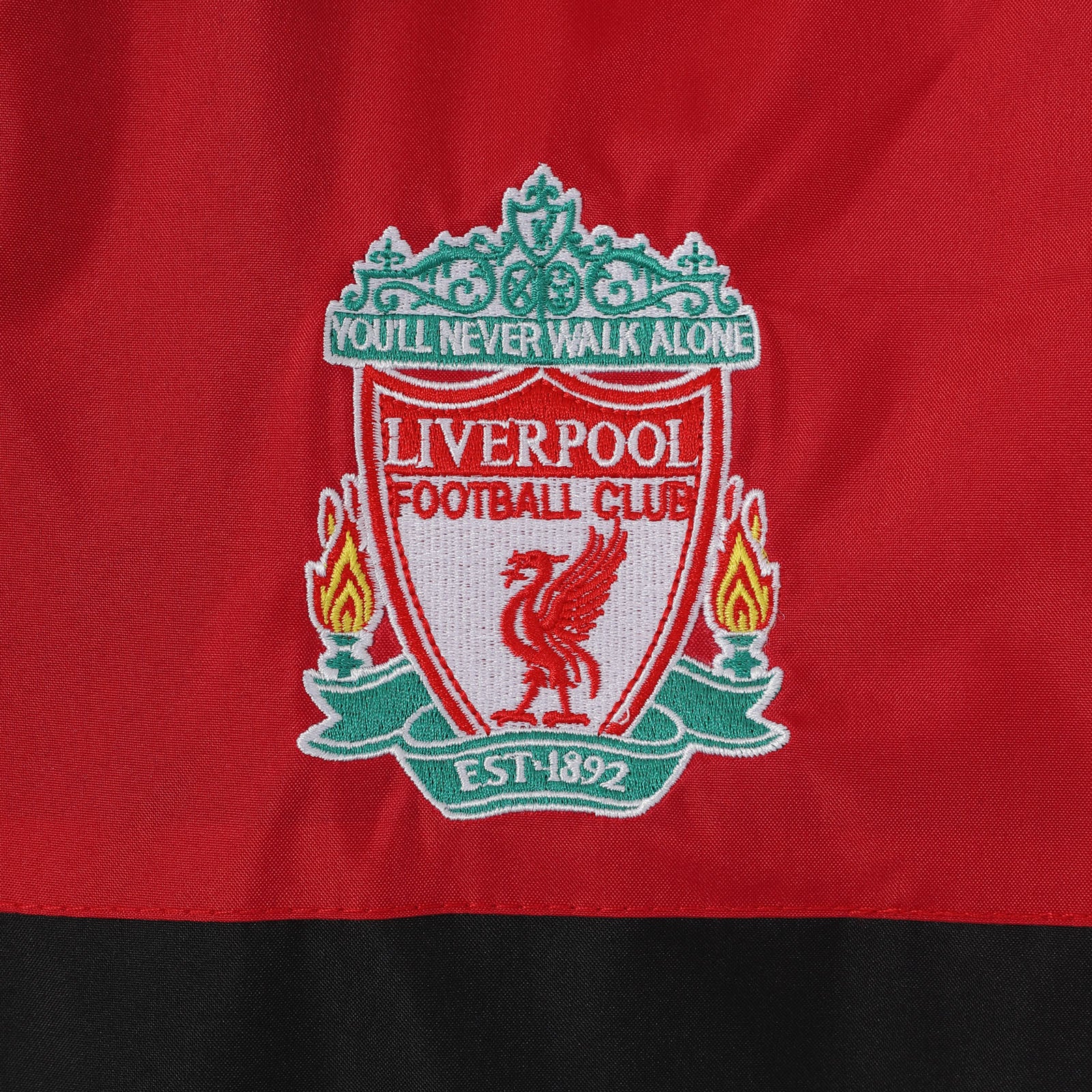 Liverpool kids shower Jacket in red with club crest to chest.