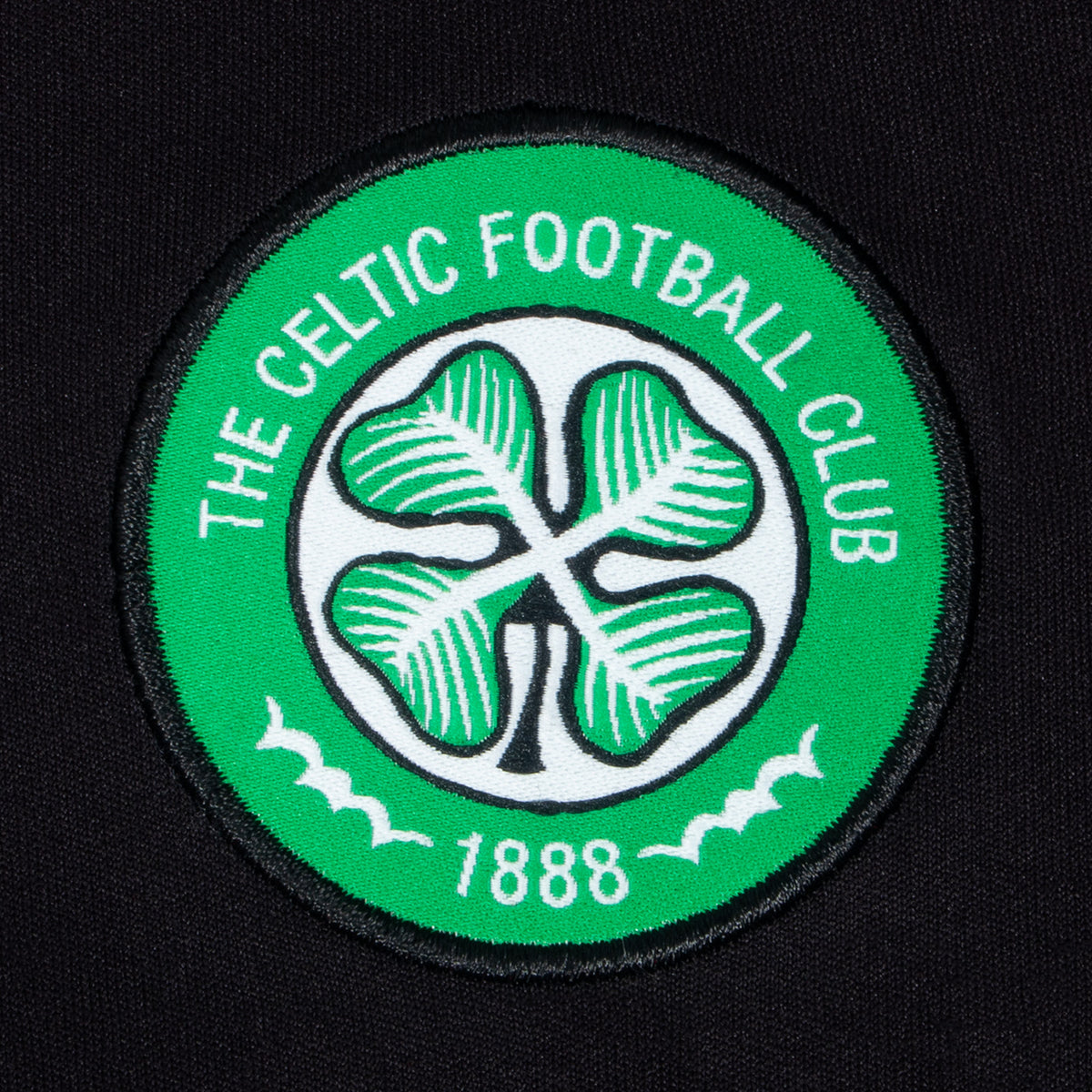 Celtic kids T-shirt in black & green stripe with club crest to chest
