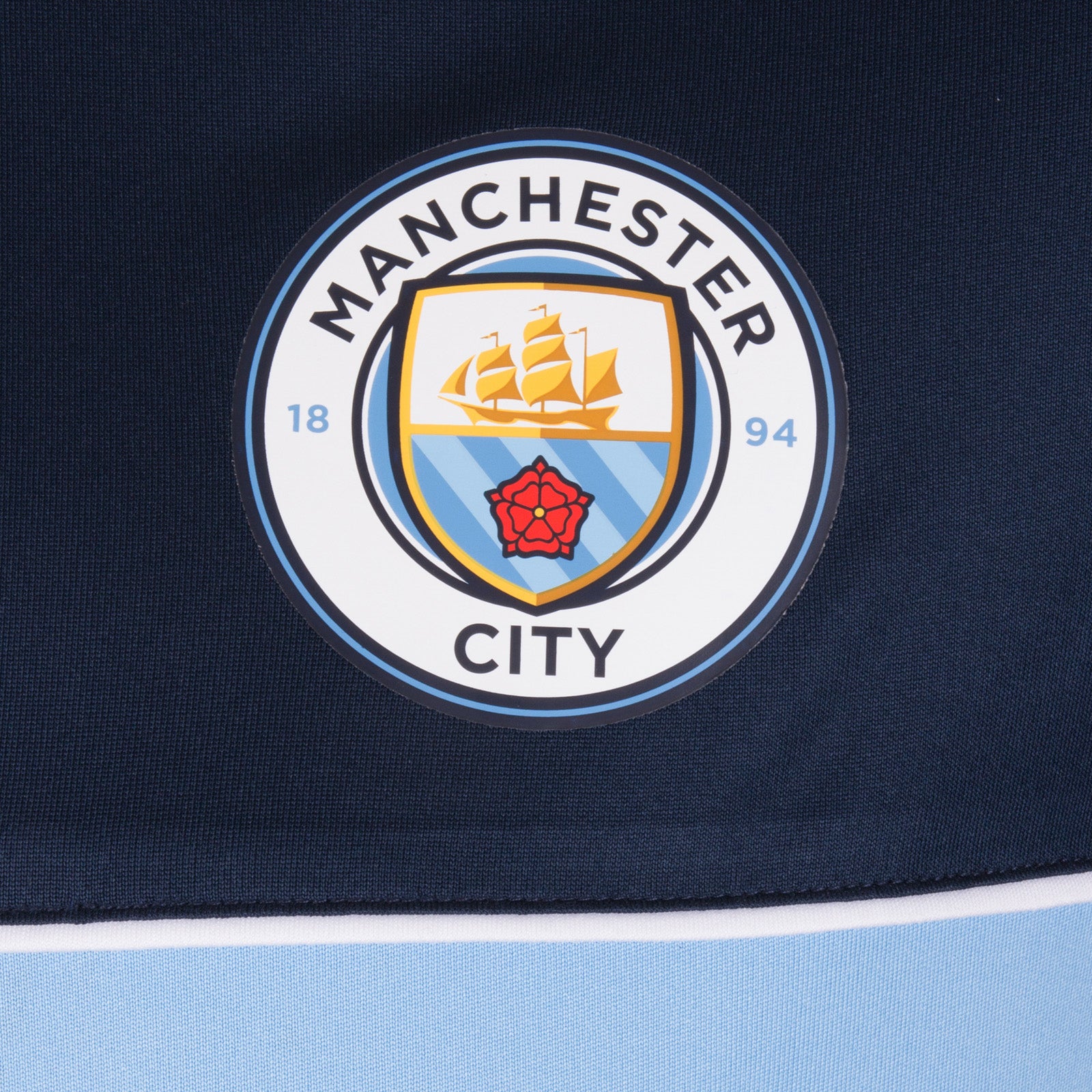 Man City adults T-shirt in navy & sky blue stripe with club crest to chest