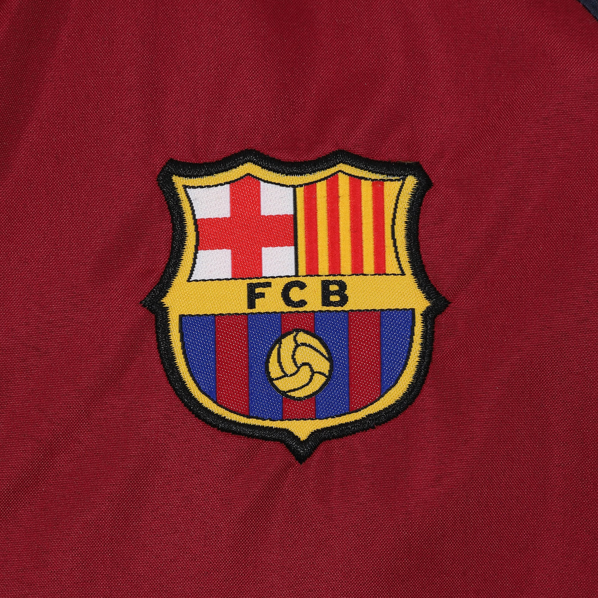 FC Barcelona adults shower jacket in navy & red with a FCB club crest to chest.
