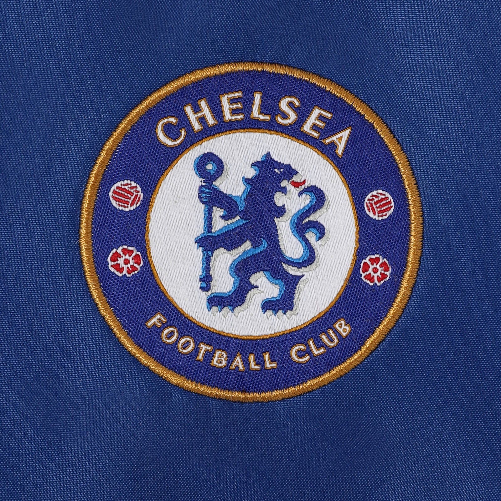Chelsea kids shower jacket in navy blue with club crest to chest.