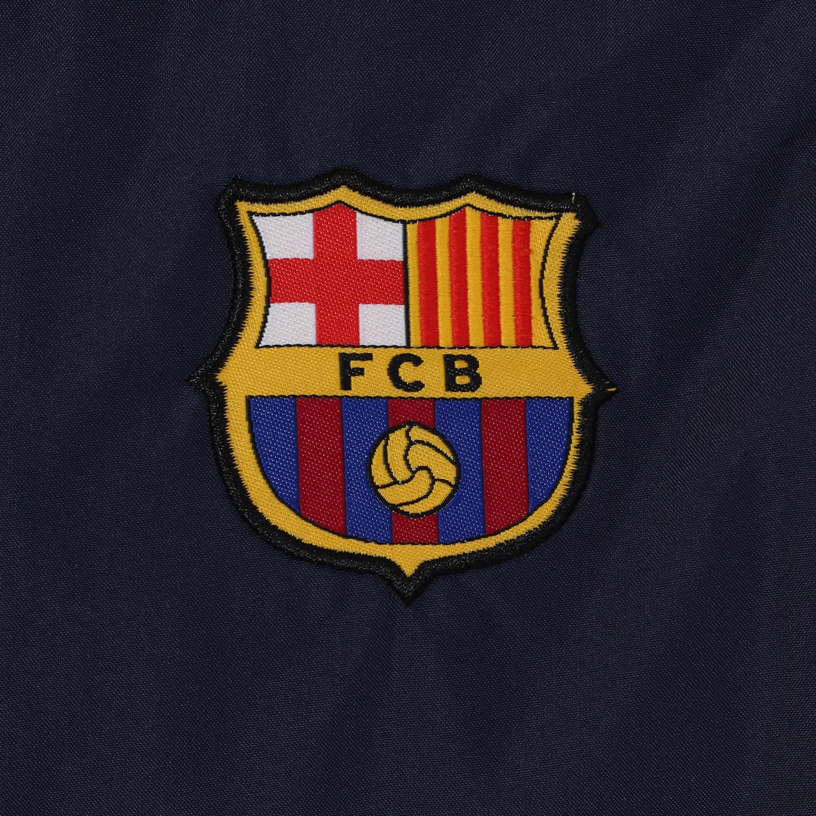 FC Barcelona kids shower jacket in navy blue with a FCB club crest to chest.