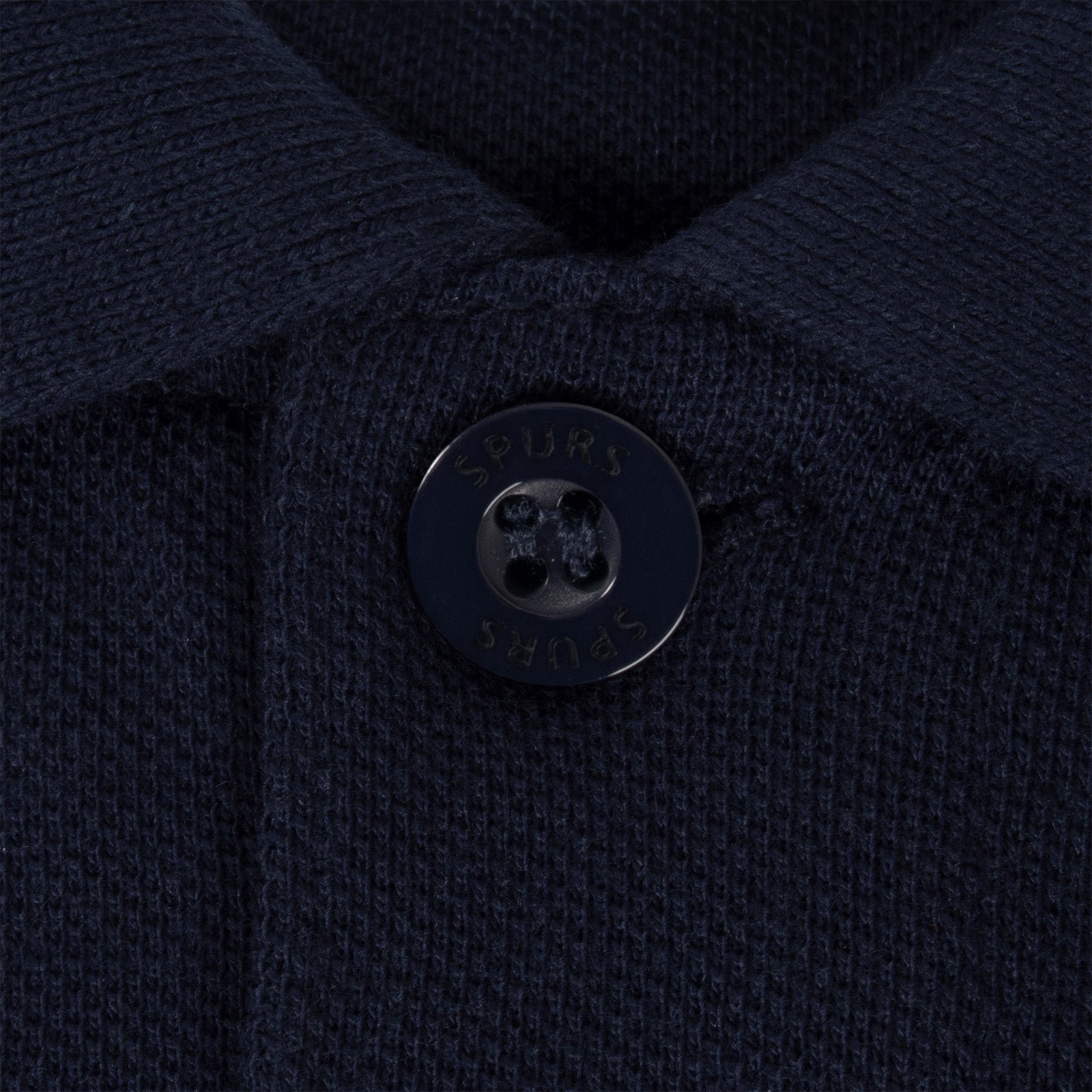 Spurs adults polo shirt in navy blue with Spurs badge and text to chest.