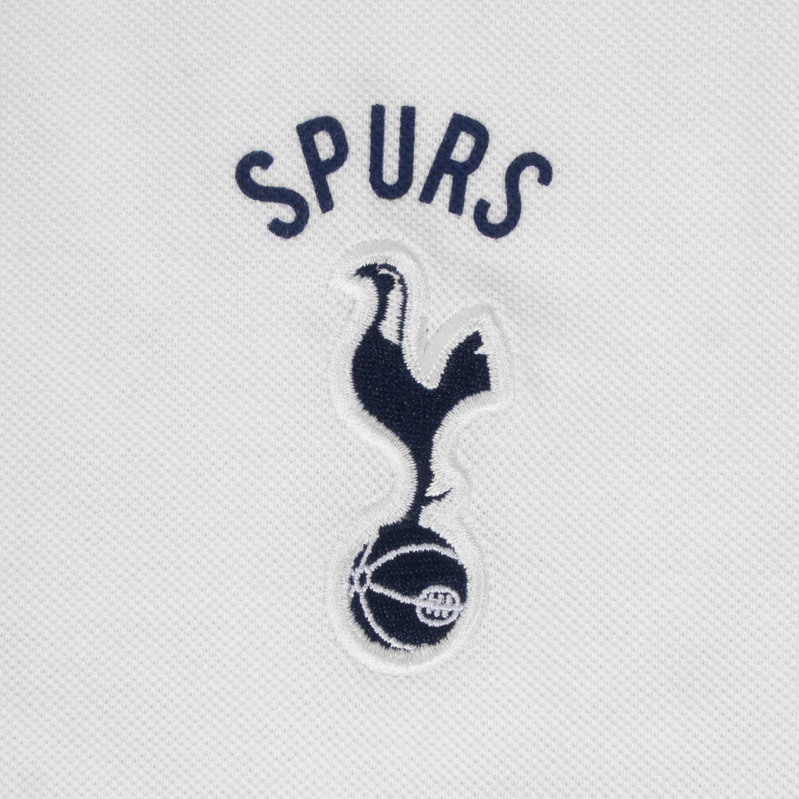 Spurs adults polo shirt in white with Spurs badge and text to chest.