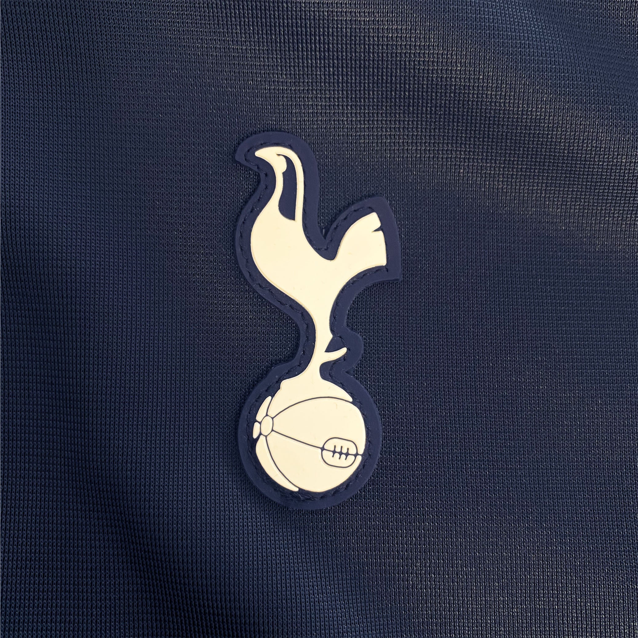 Spurs kids retro track jacket in navy blue with club crest to chest.