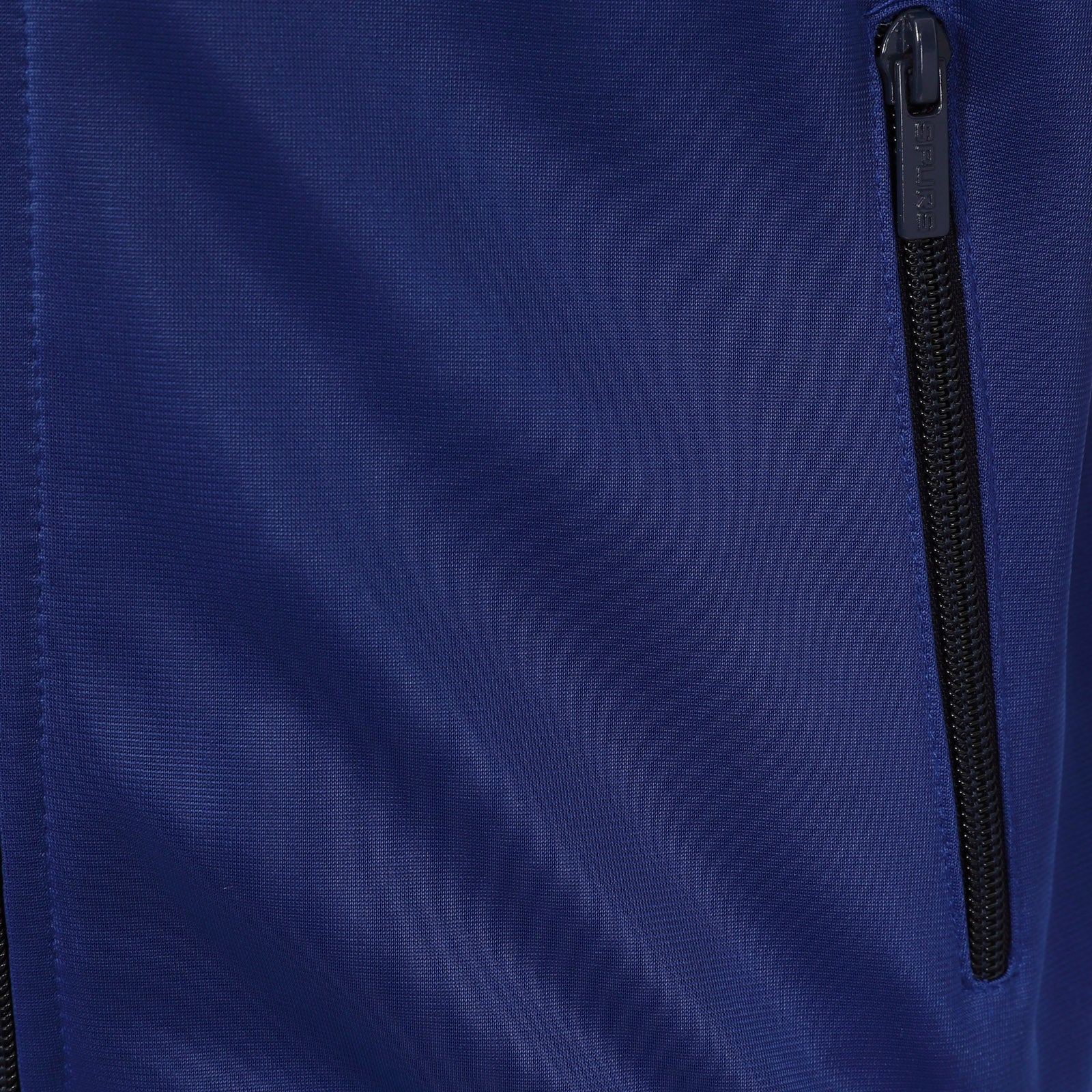 Spurs kids retro track jacket in navy & royal blue with club crest to chest.