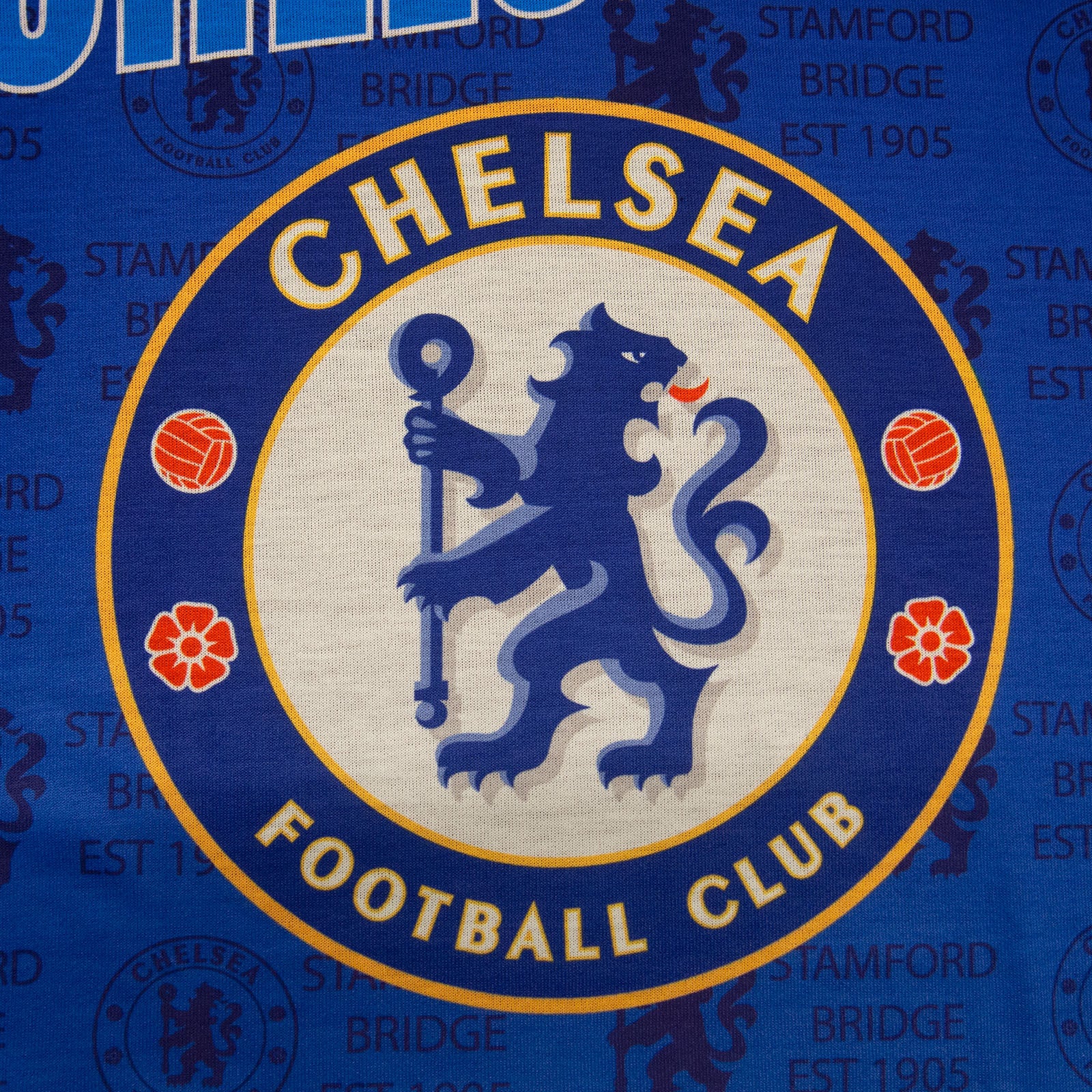 Chelsea kids pyjamas in blue. Short sleeve top with Chelsea branded graphic and shorts with CFC logo to the left leg