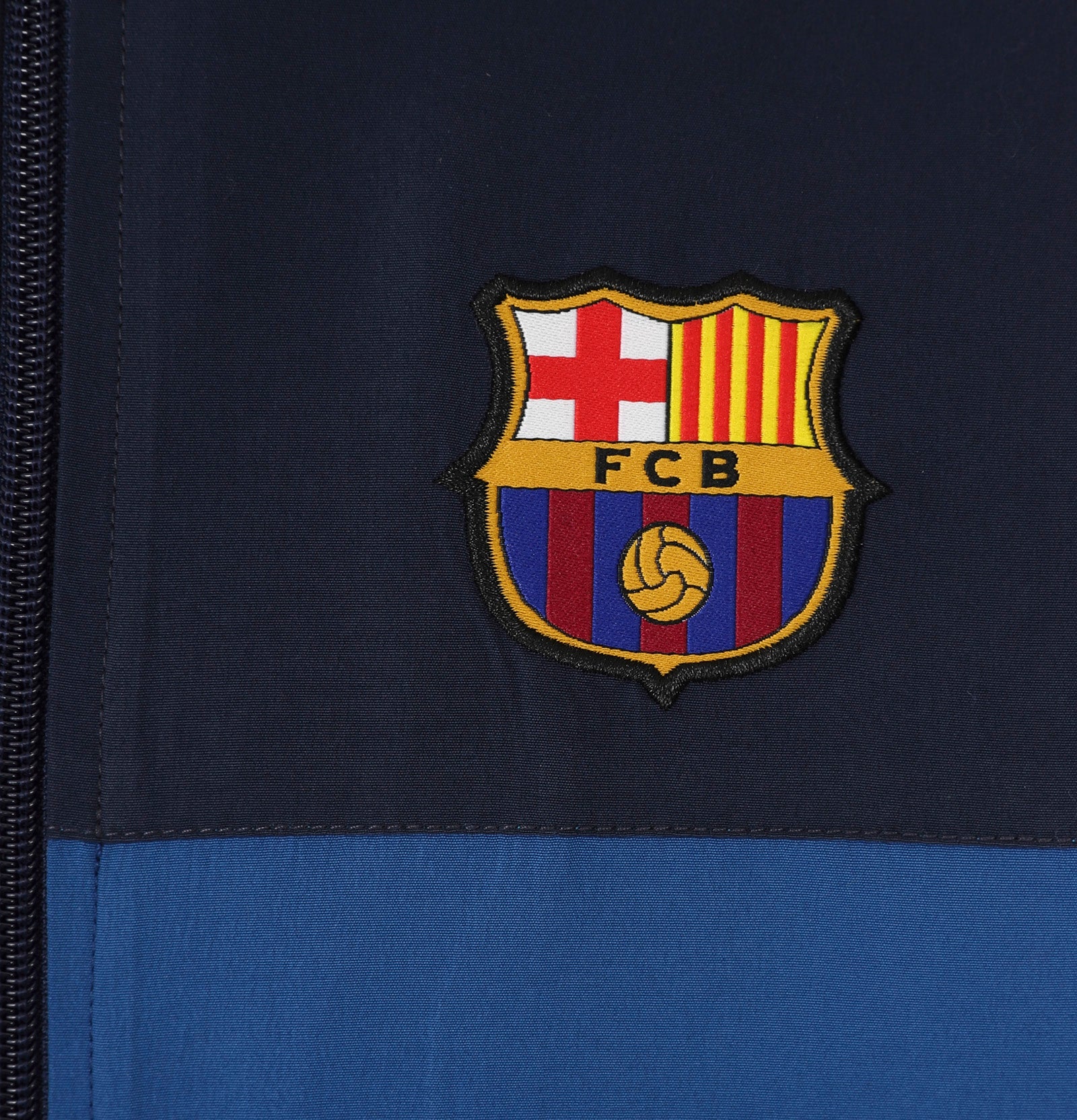 FC Barcelona kids tracksuit in reflex blue with club crest to chest and left thigh
