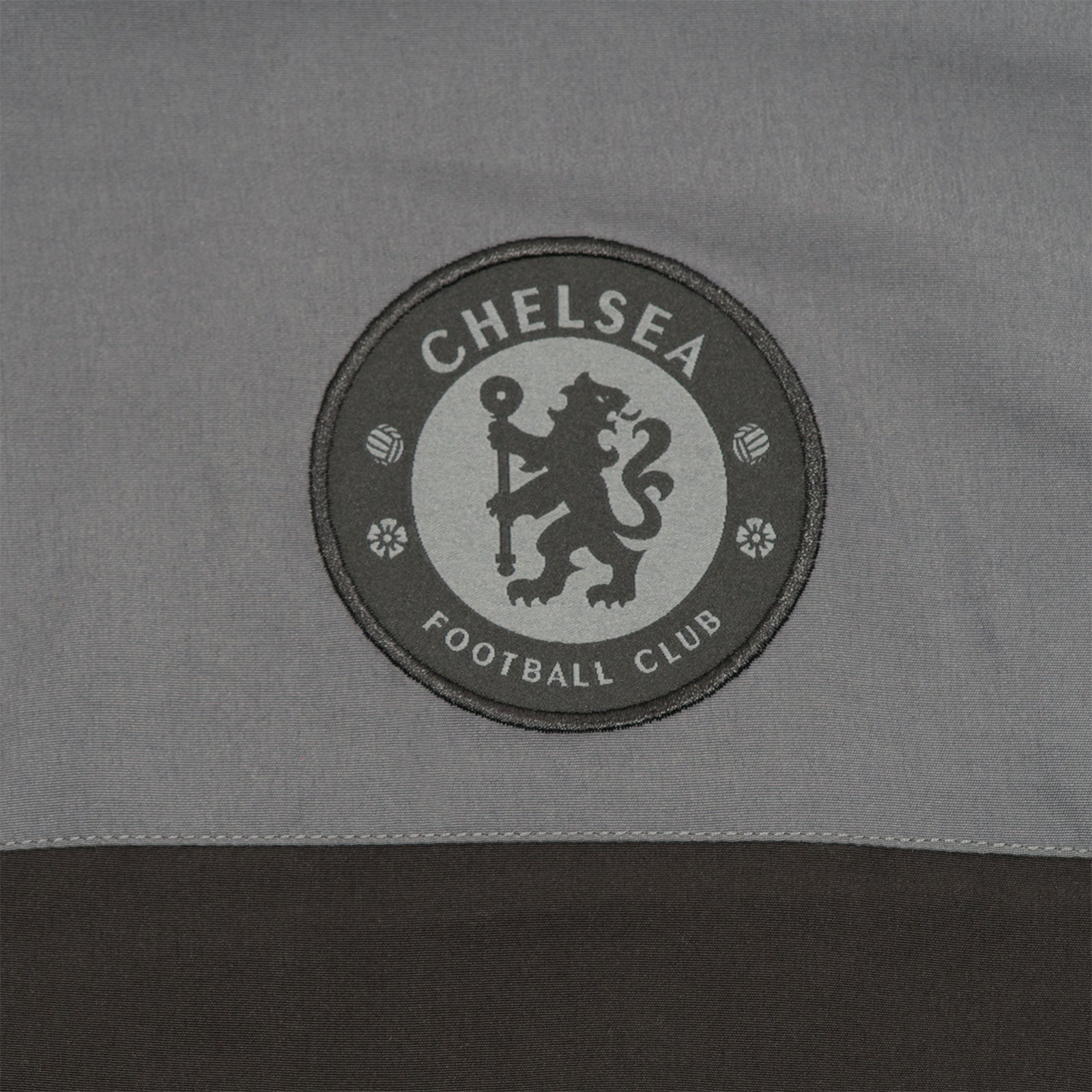 Chelsea adults tracksuit in grey with club crest to chest and left thigh