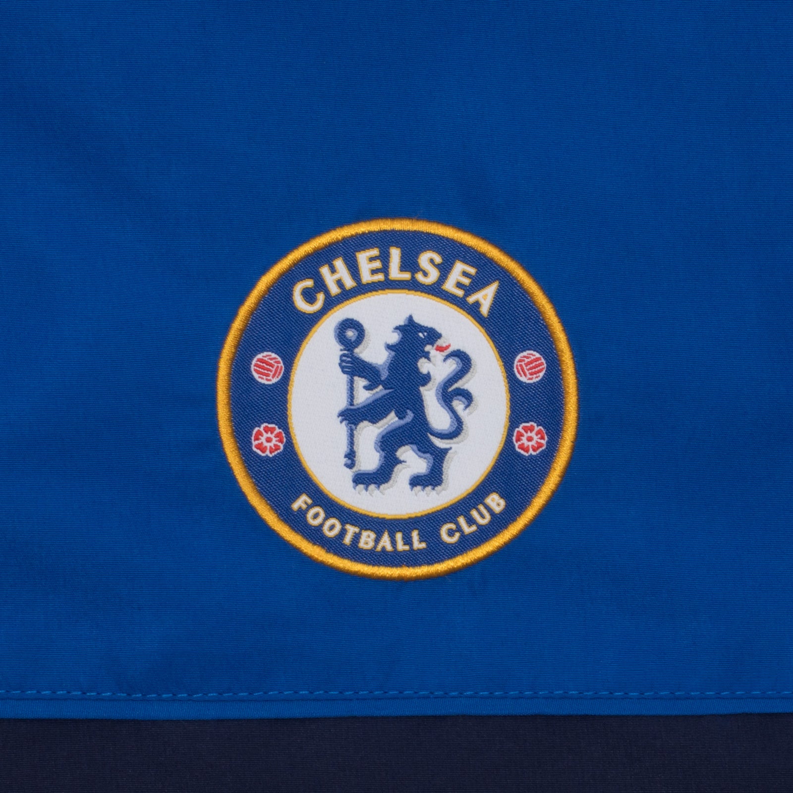 Chelsea adults tracksuit in navy blue with club crest to chest and left thigh