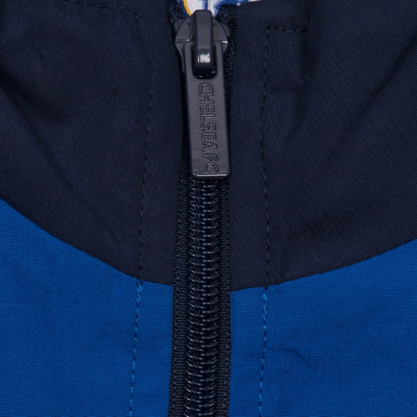 Chelsea adults tracksuit in navy blue with club crest to chest and left thigh