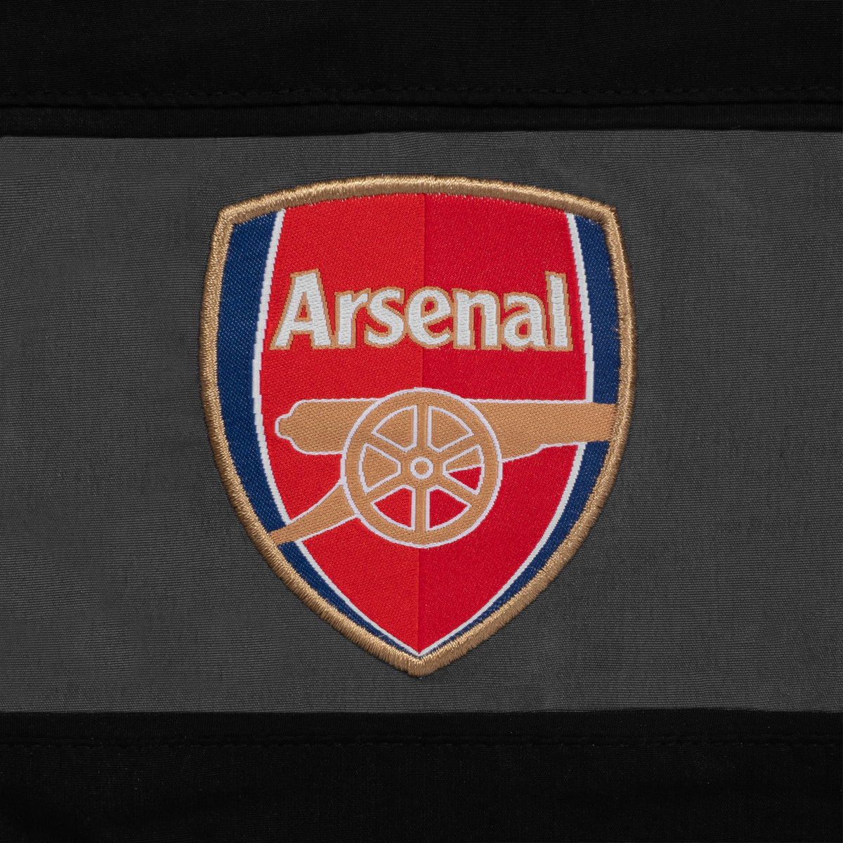 Arsenal adults tracksuit in black & grey with club crest to chest and left thigh
