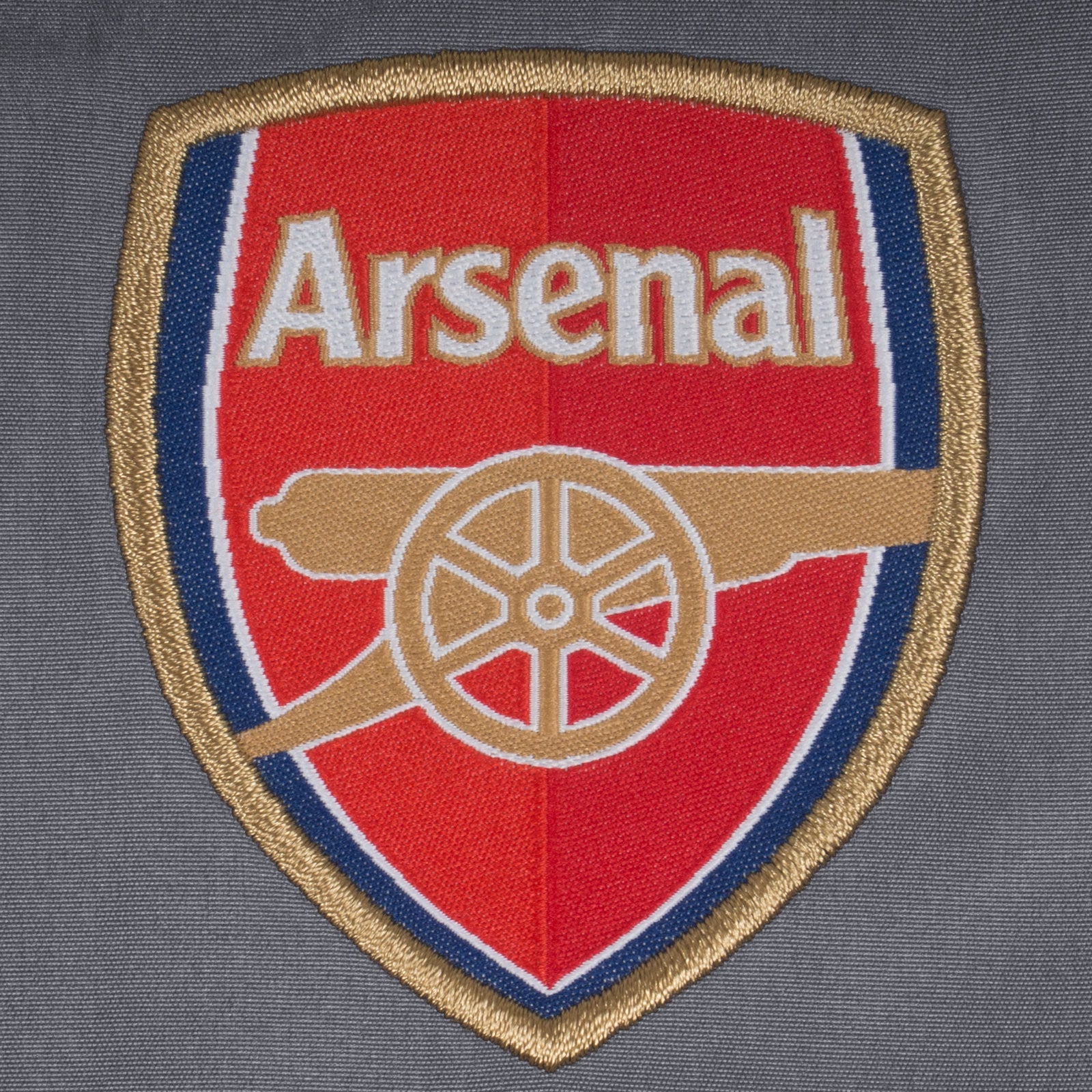 Arsenal kids tracksuit in grey with club crest to chest and left thigh