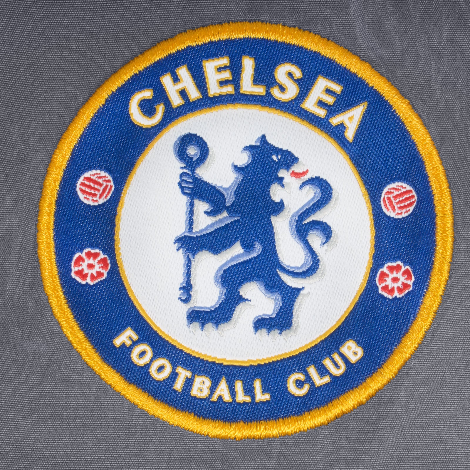 Chelsea kids tracksuit in grey with club crest to chest and left thigh