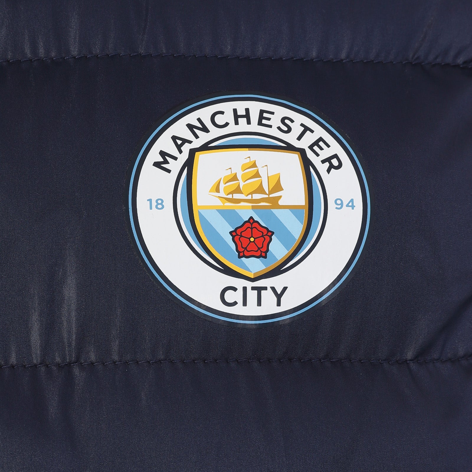 Man City adults gilet in black with full colour club crest to chest.