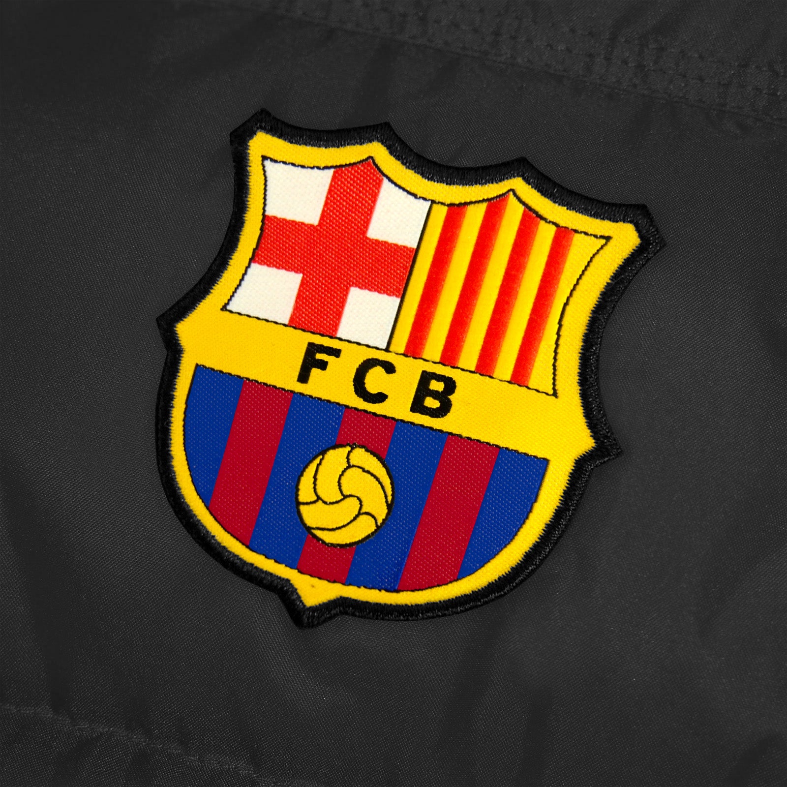 FC Barcelona kids gilet in black with FCB club crest to the left chest.