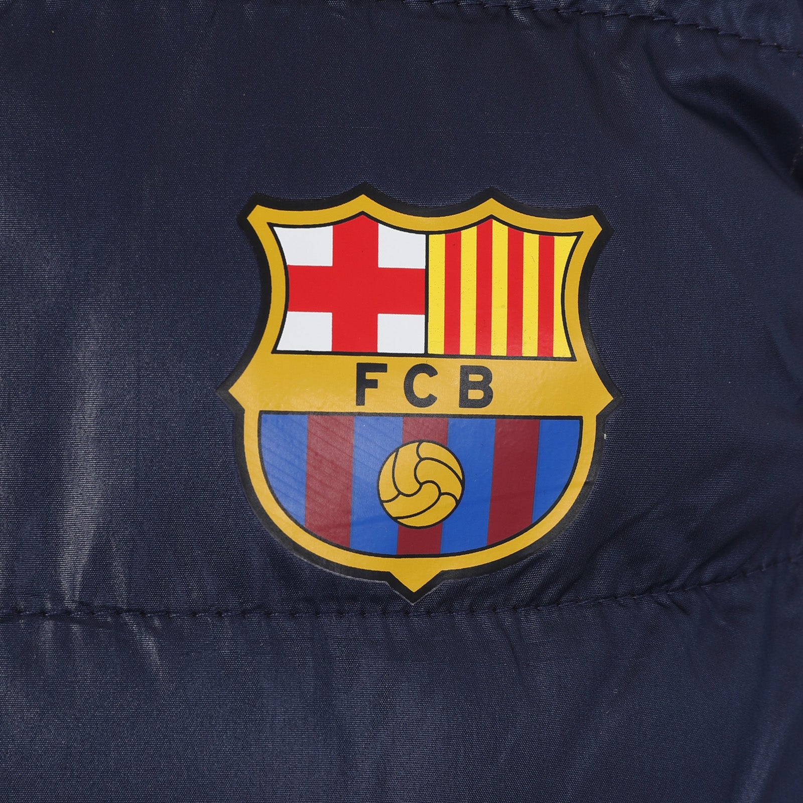 FC Barcelona kids gilet in black with FCB club crest to the left chest.