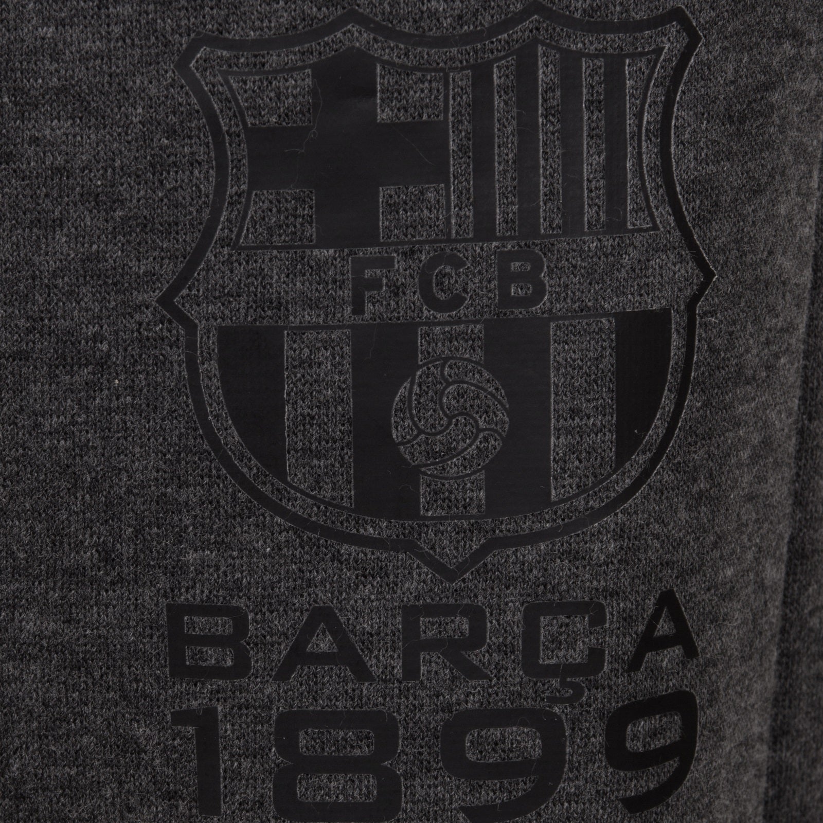 FC Barcelona kids slim fit track pants in black with club crest and text to left leg.
