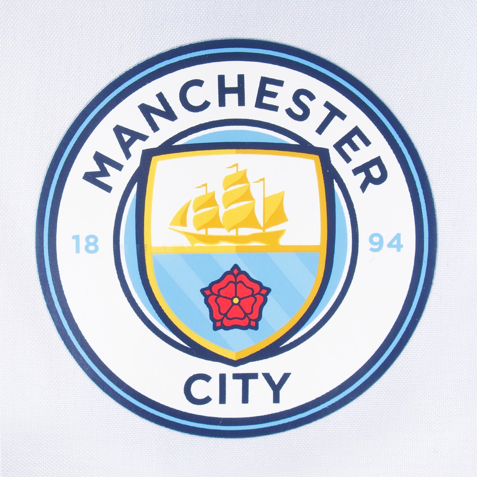 Man City kids shower jacket in white with club crest to chest.