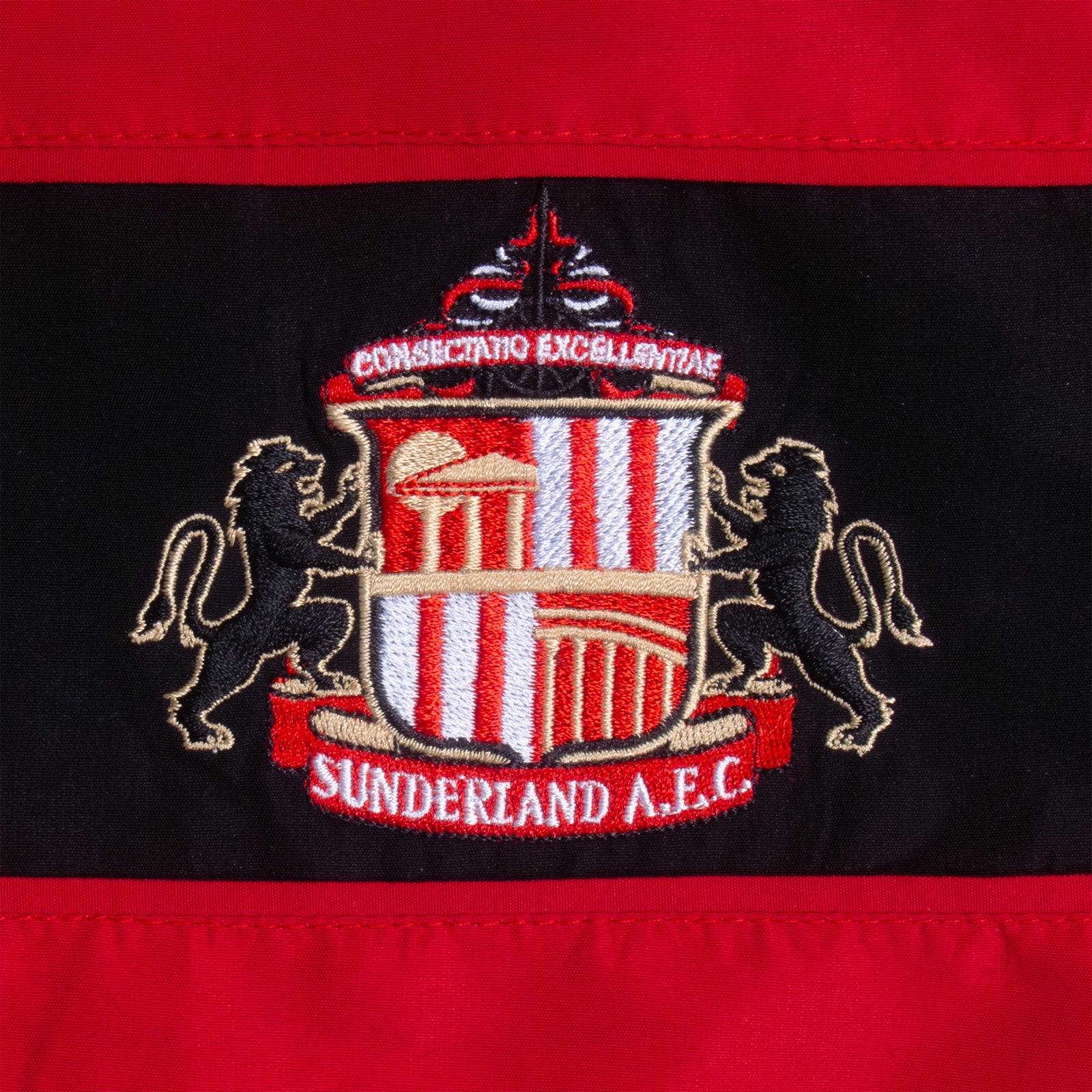 Sunderland kids tracksuit in red with club crest to chest and left thigh