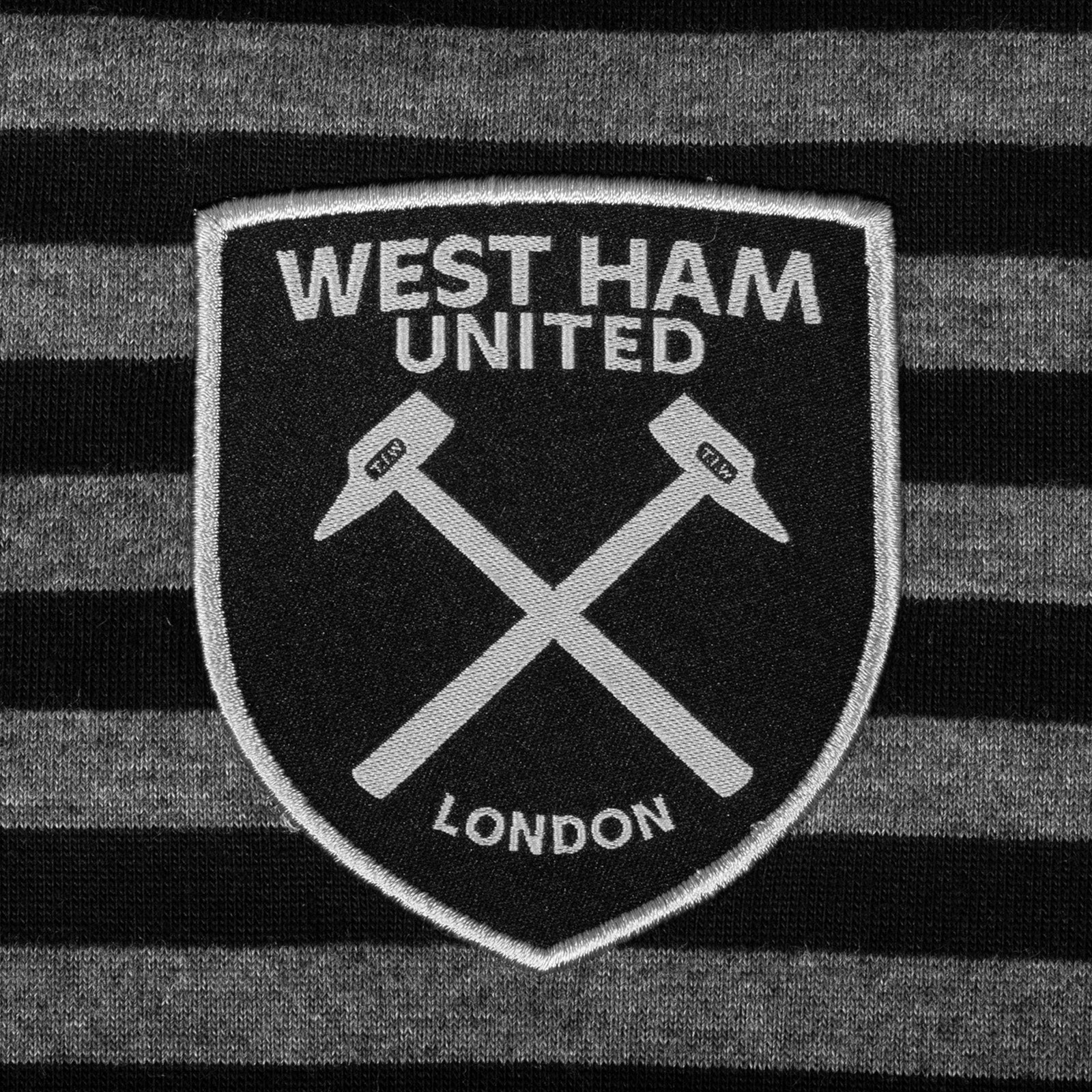 West Ham adults striped polo shirt in black & grey with club crest to chest.