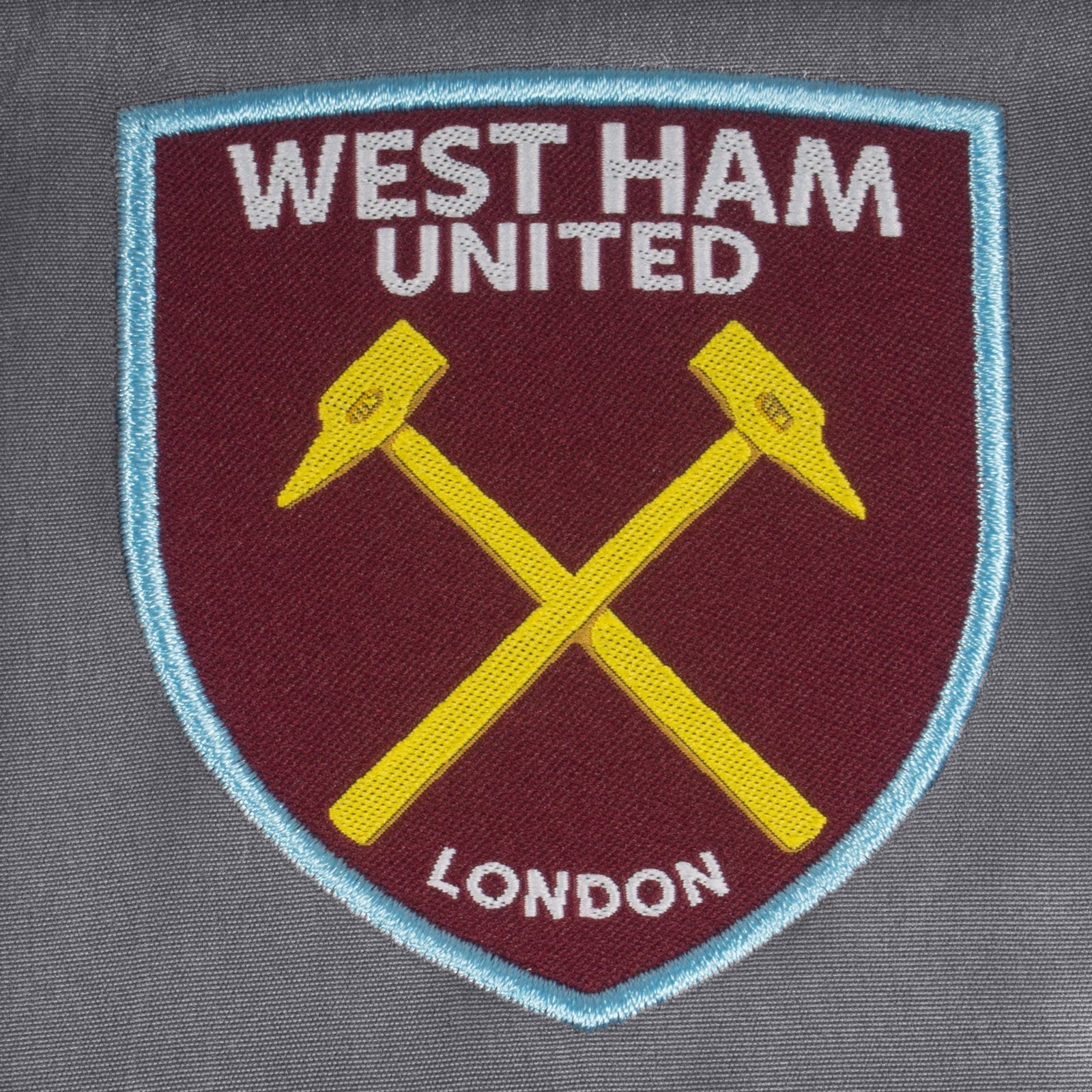 West Ham kids tracksuit in grey with club crest to chest and left thigh