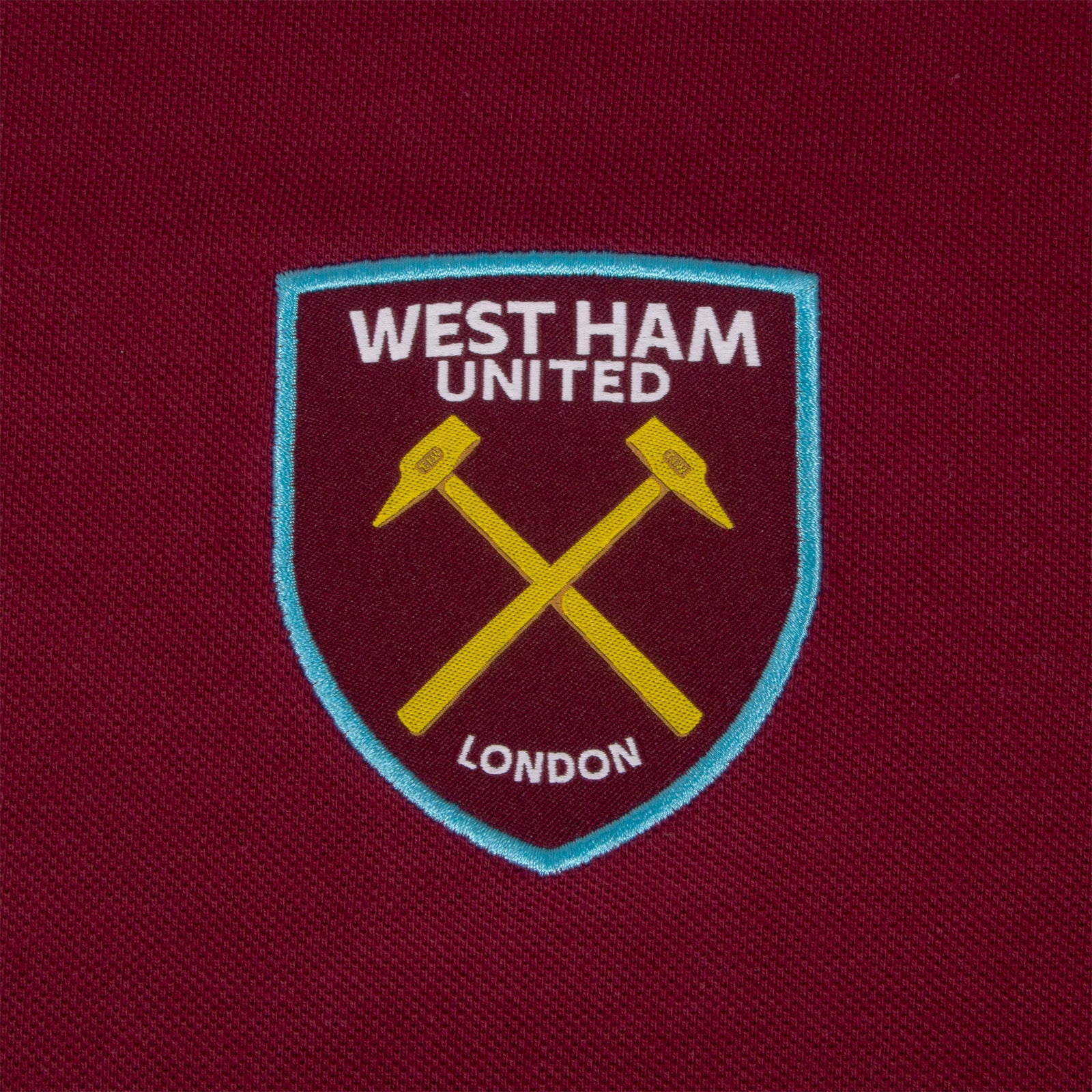 West Ham adults polo shirt in claret with WHUFC badge and text to chest.