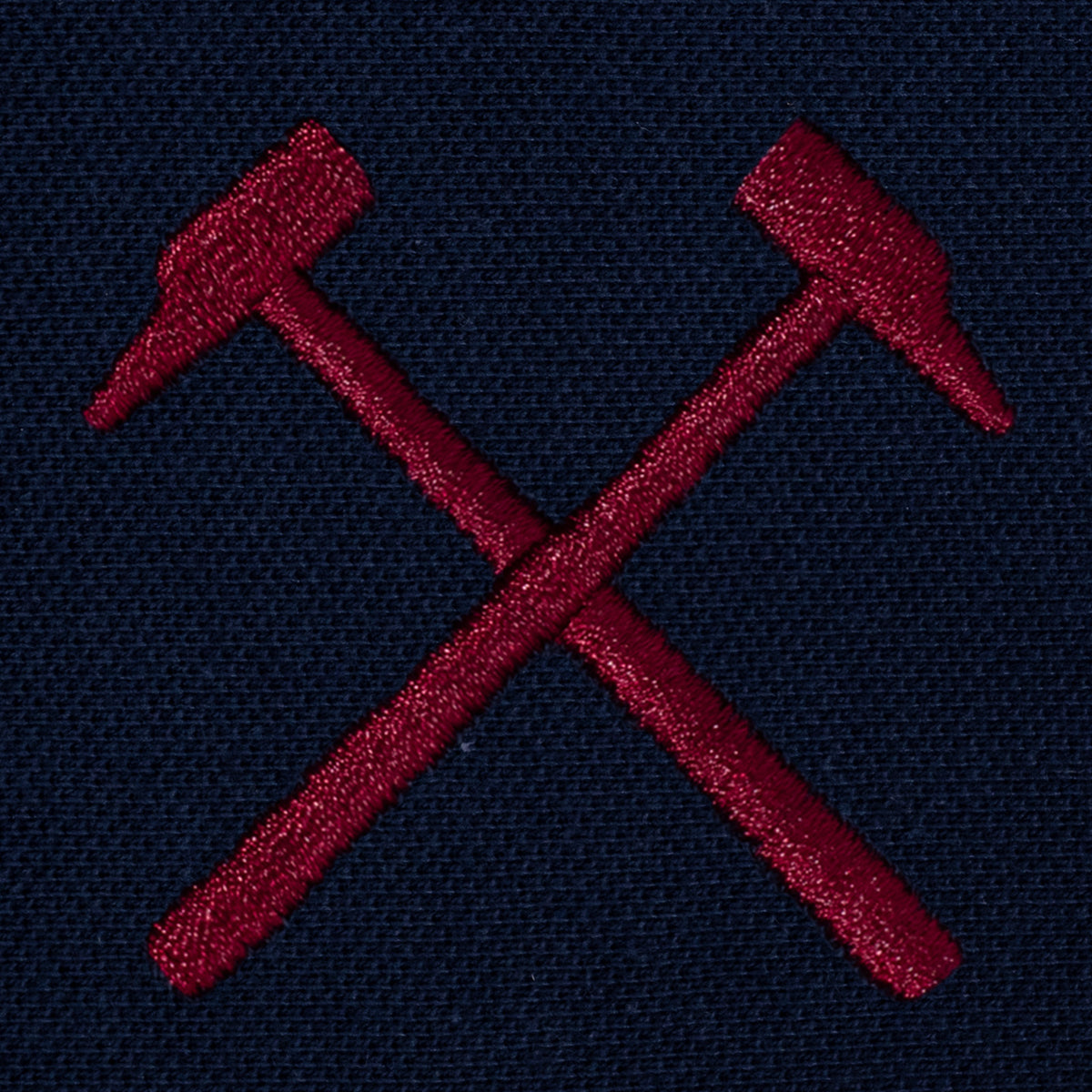 West Ham adults polo shirt in navy with WHUFC badge and text to chest.